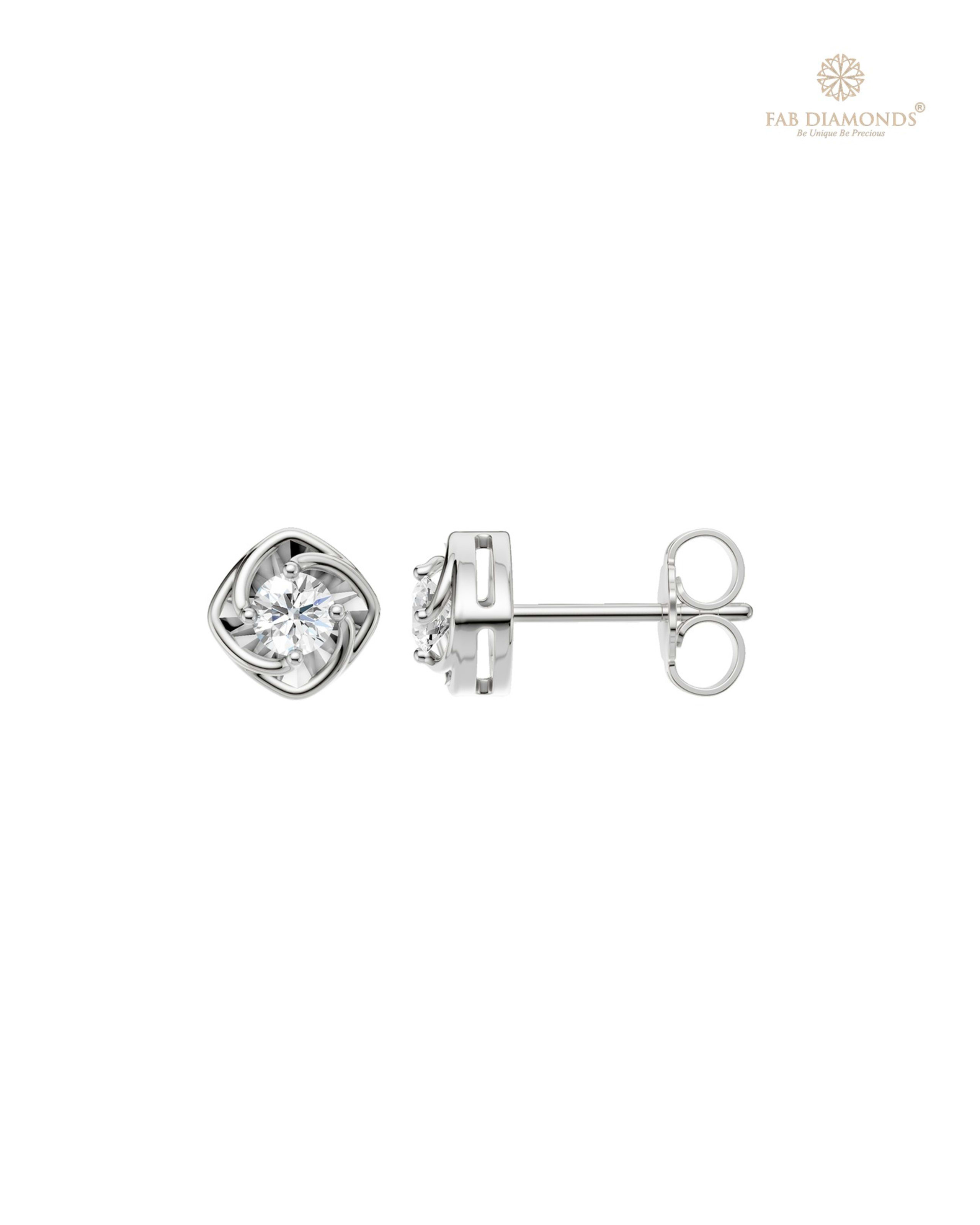 The ES01435 Classic Solitaire Diamond Studs (0.24 Cts) on white atelier plate with FAB hallmark