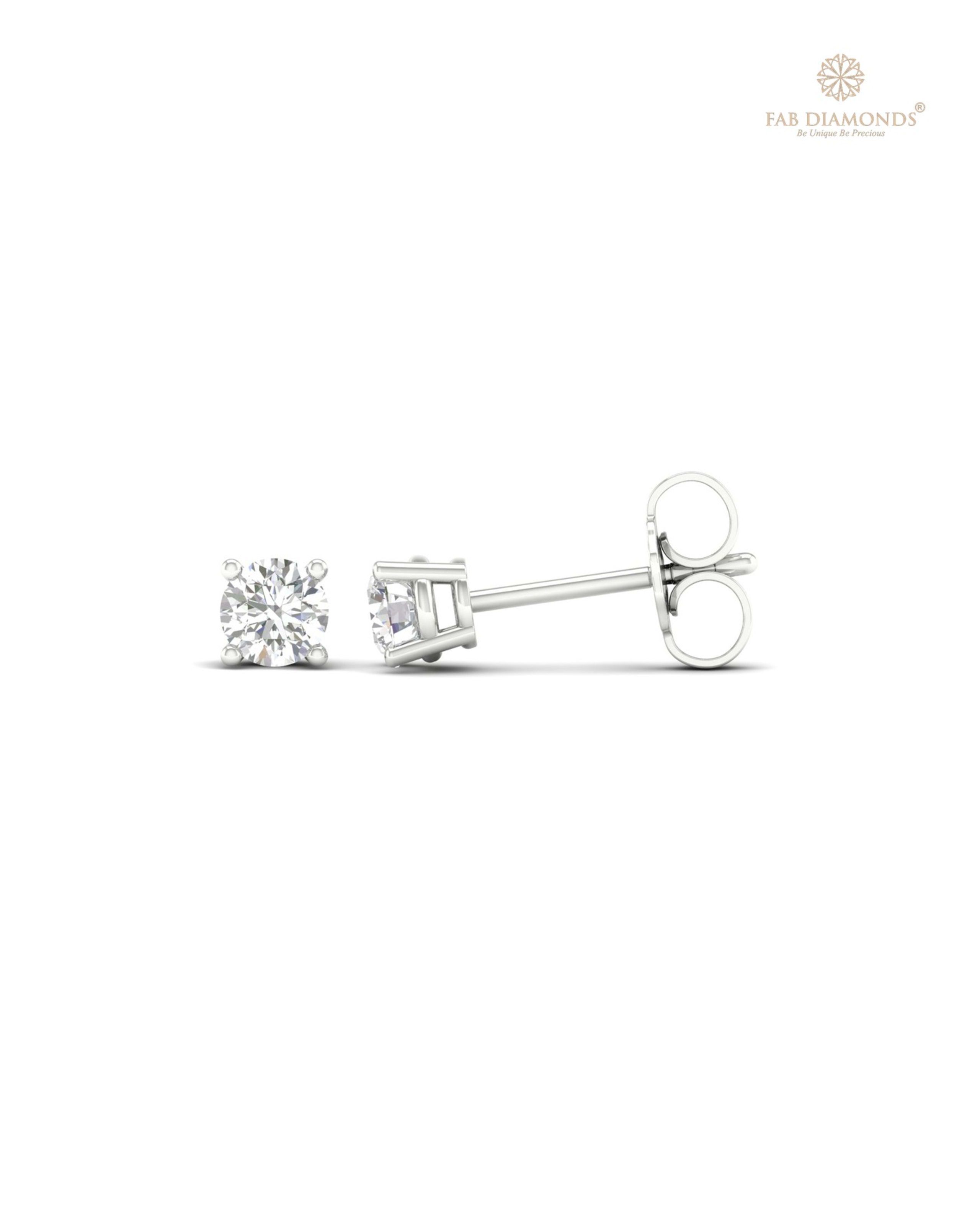 The ES01457 Classic Solitaire Diamond Studs (0.40 Cts) on white atelier plate with FAB hallmark