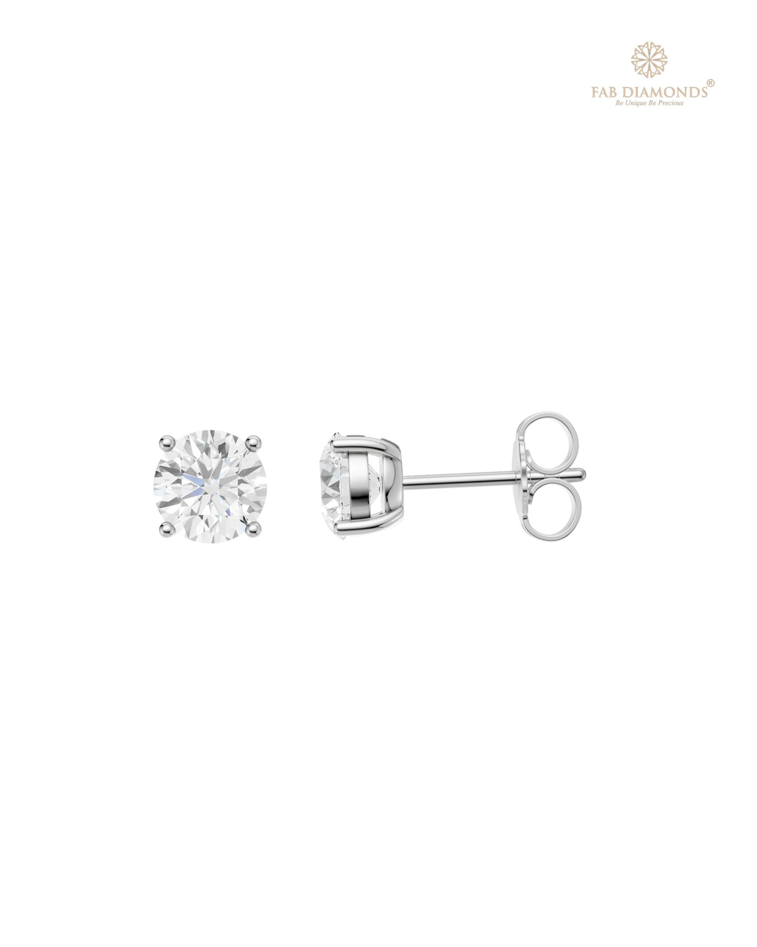 The ES01475 Classic Solitaire Diamond Studs (1.20 Cts) on white atelier plate with FAB hallmark