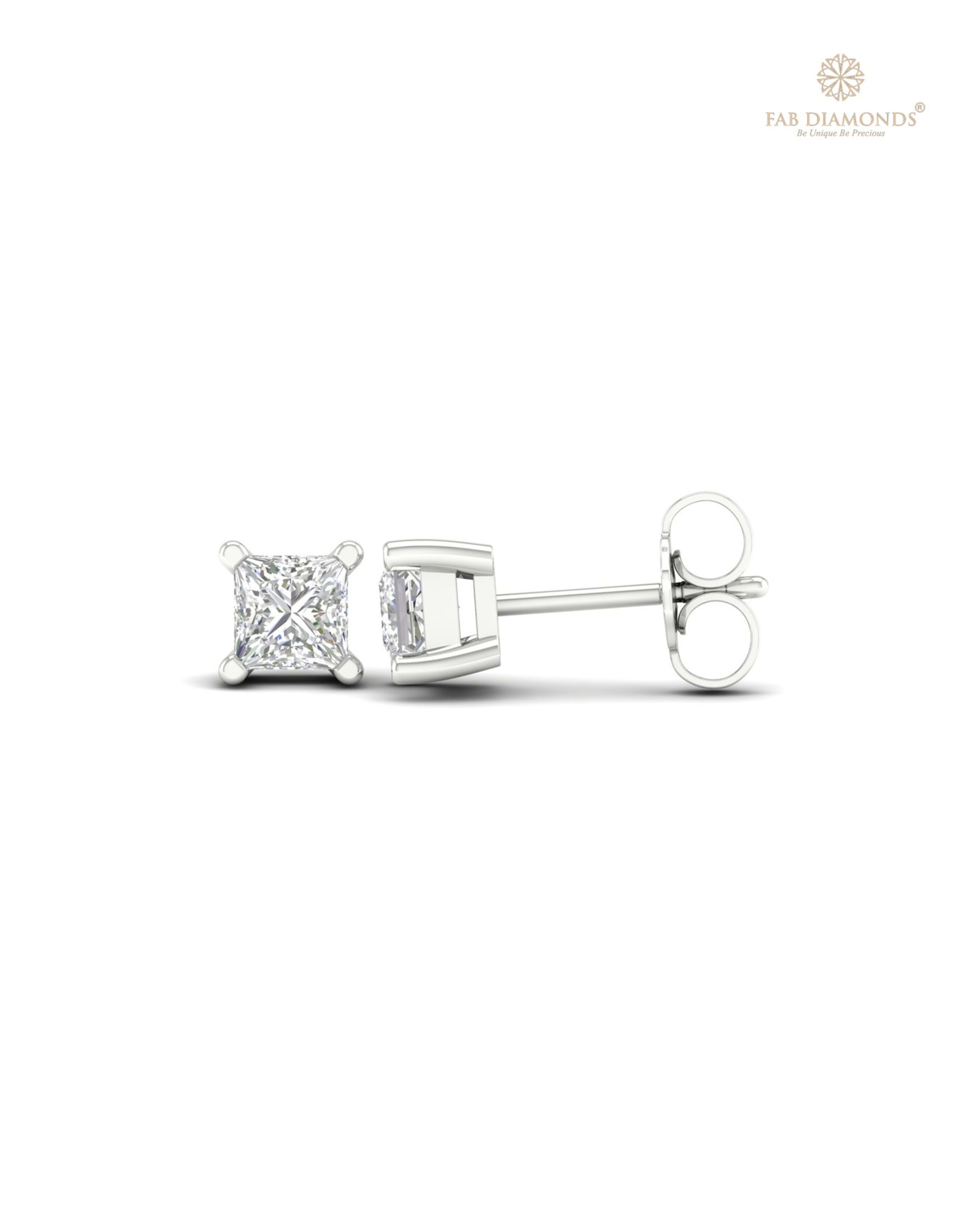 The ES01539 Classic Solitaire Diamond Studs (0.84 Cts) on white atelier plate with FAB hallmark