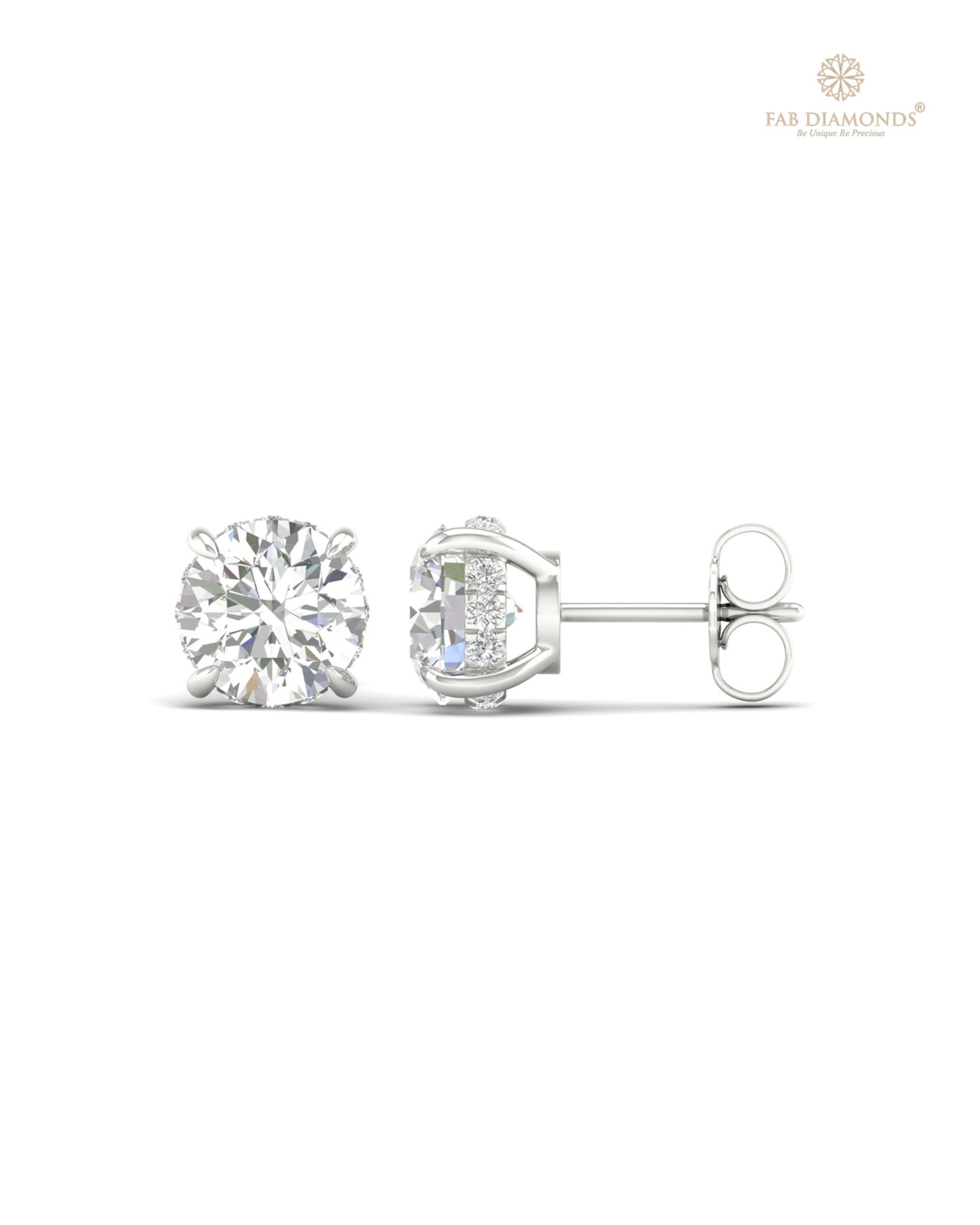 The ES10048 Diamond Halo Diamond Studs (3.16 Cts) on white atelier plate with FAB hallmark