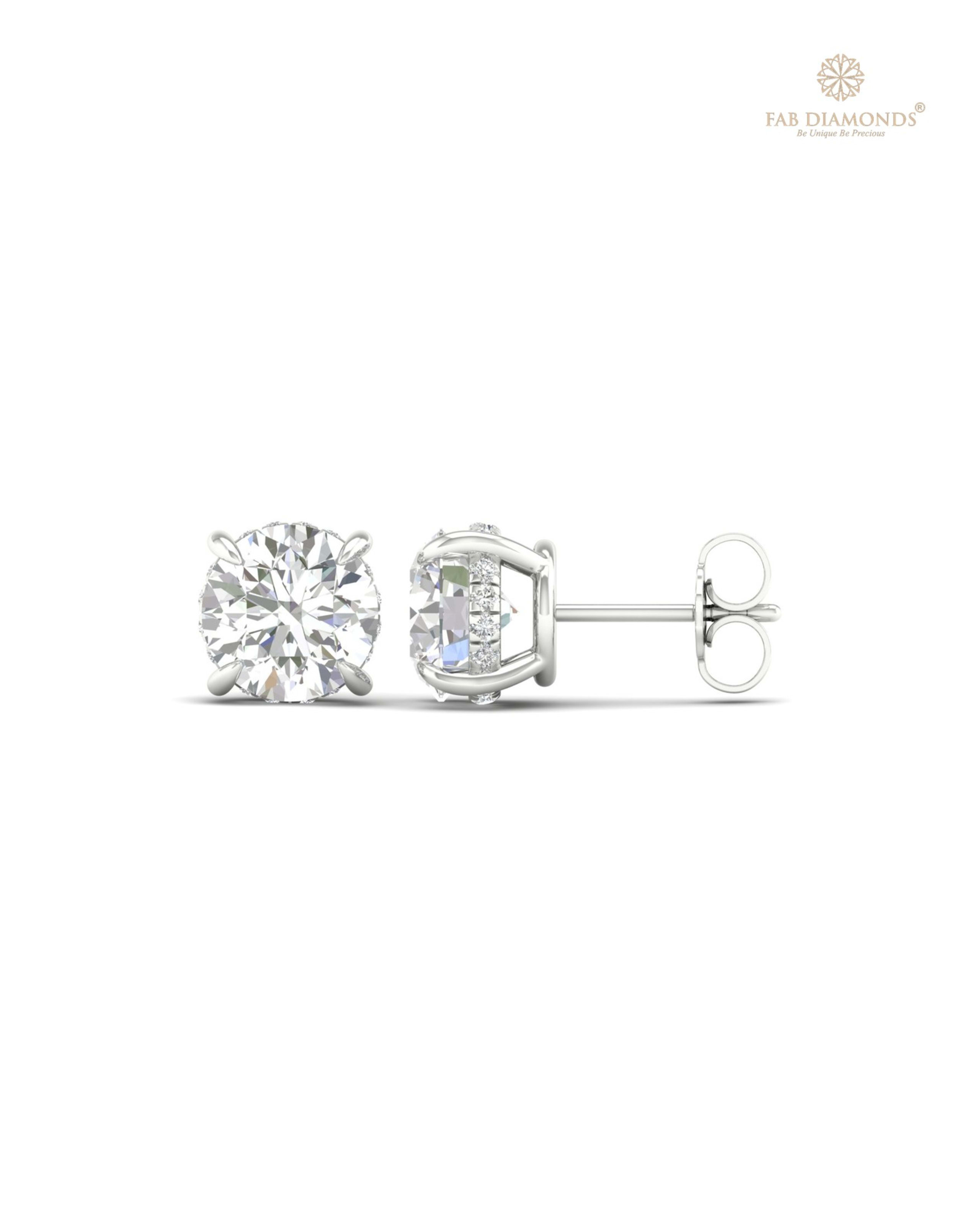 The ES10049 Diamond Halo Diamond Studs (4.19 Cts) on white atelier plate with FAB hallmark
