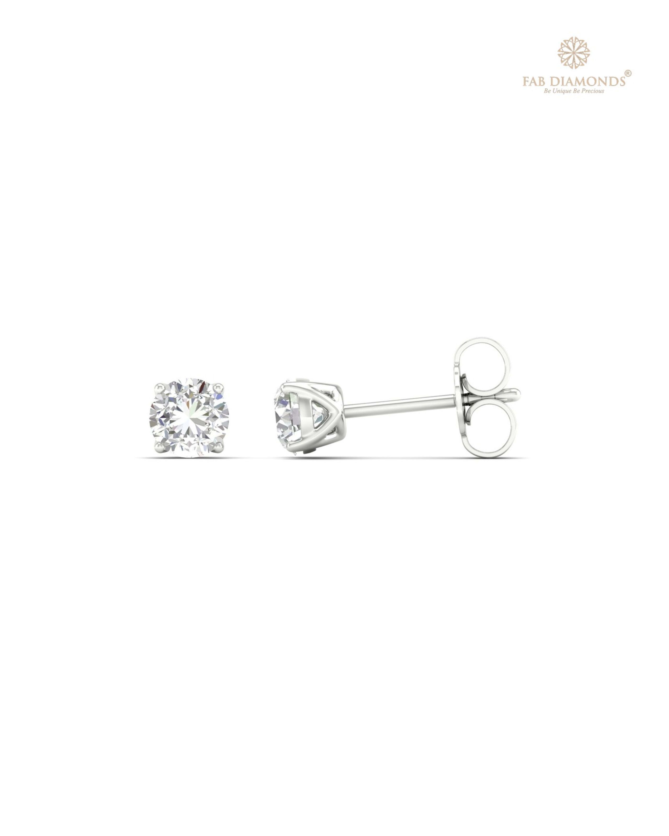 The ES10133 Classic Solitaire Diamond Studs (0.60 Cts) on white atelier plate with FAB hallmark