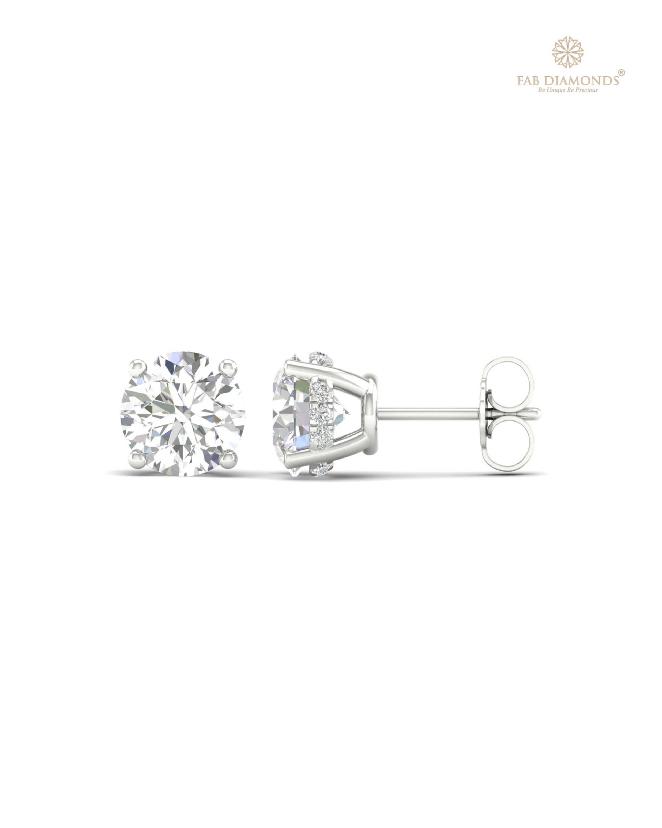 The ES10262 Diamond Halo Diamond Studs (3.15 Cts) on white atelier plate with FAB hallmark