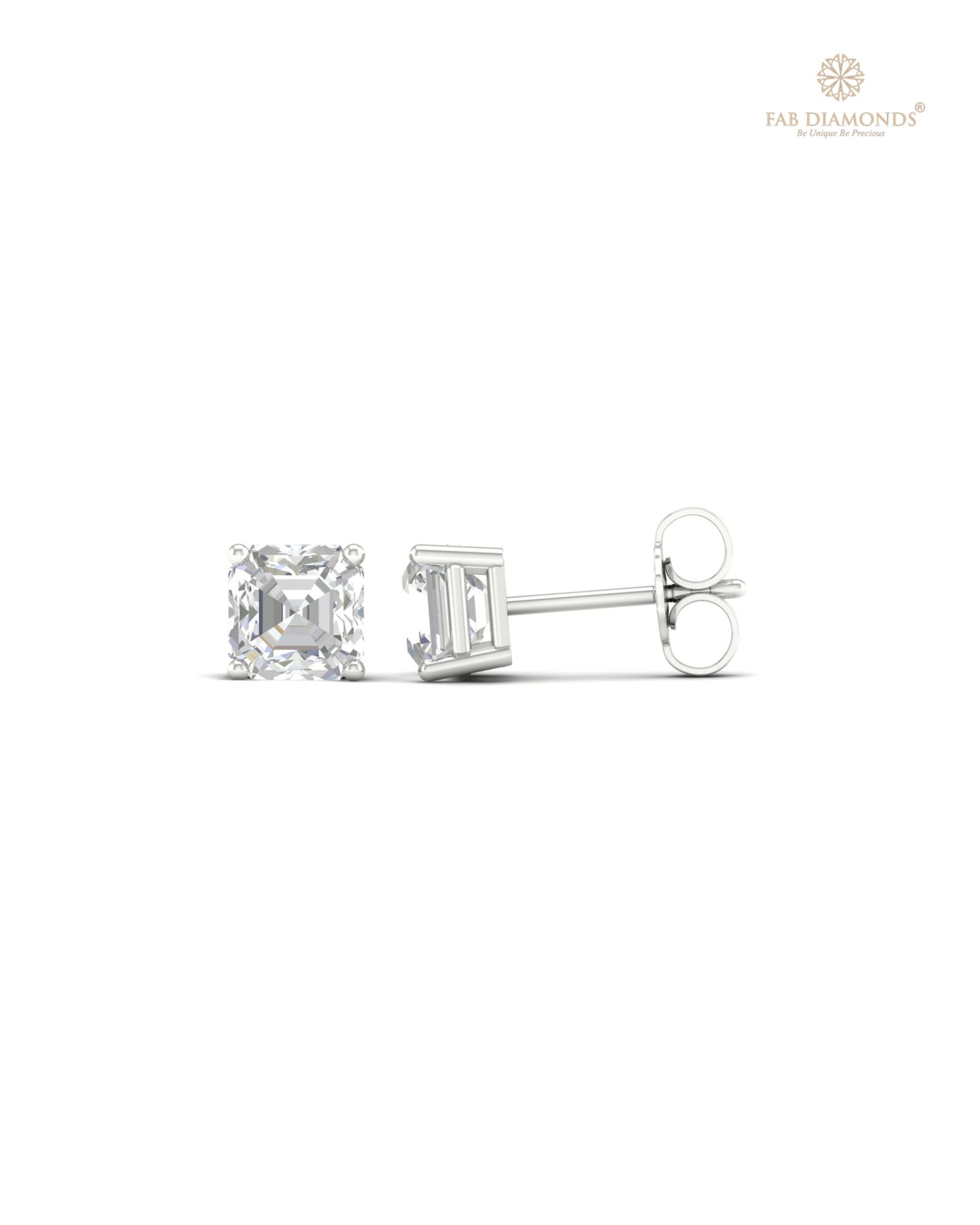 The ES10335 Classic Solitaire Diamond Studs (1.50 Cts) on white atelier plate with FAB hallmark