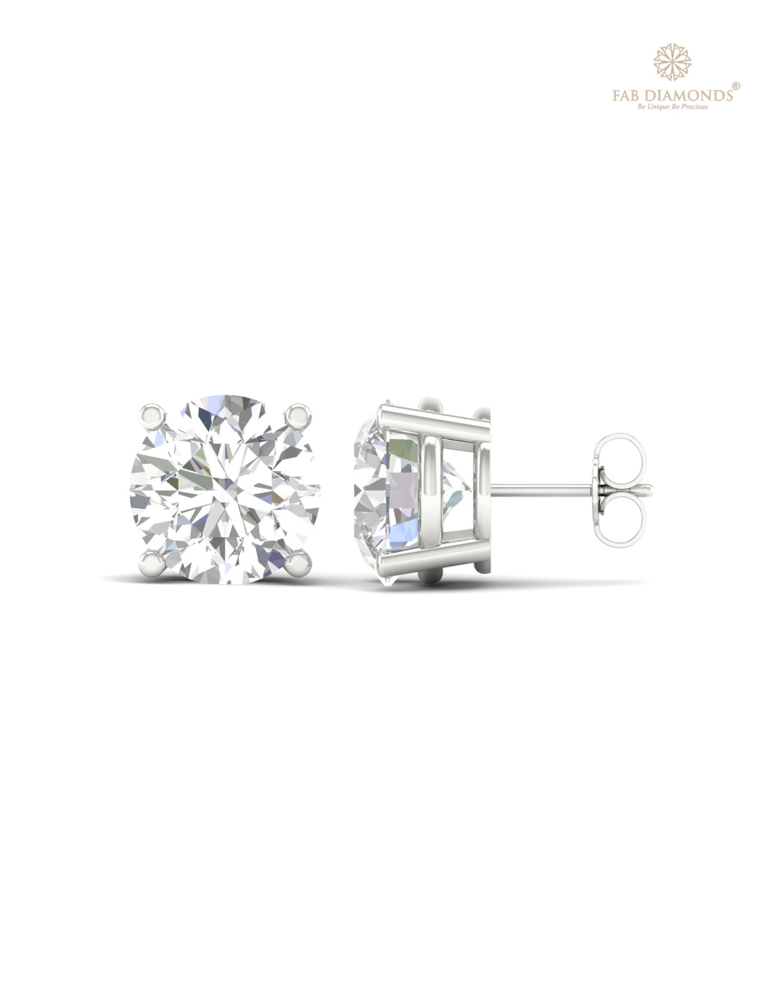 The ES10349 Classic Solitaire Diamond Studs (10.00 Cts) on white atelier plate with FAB hallmark