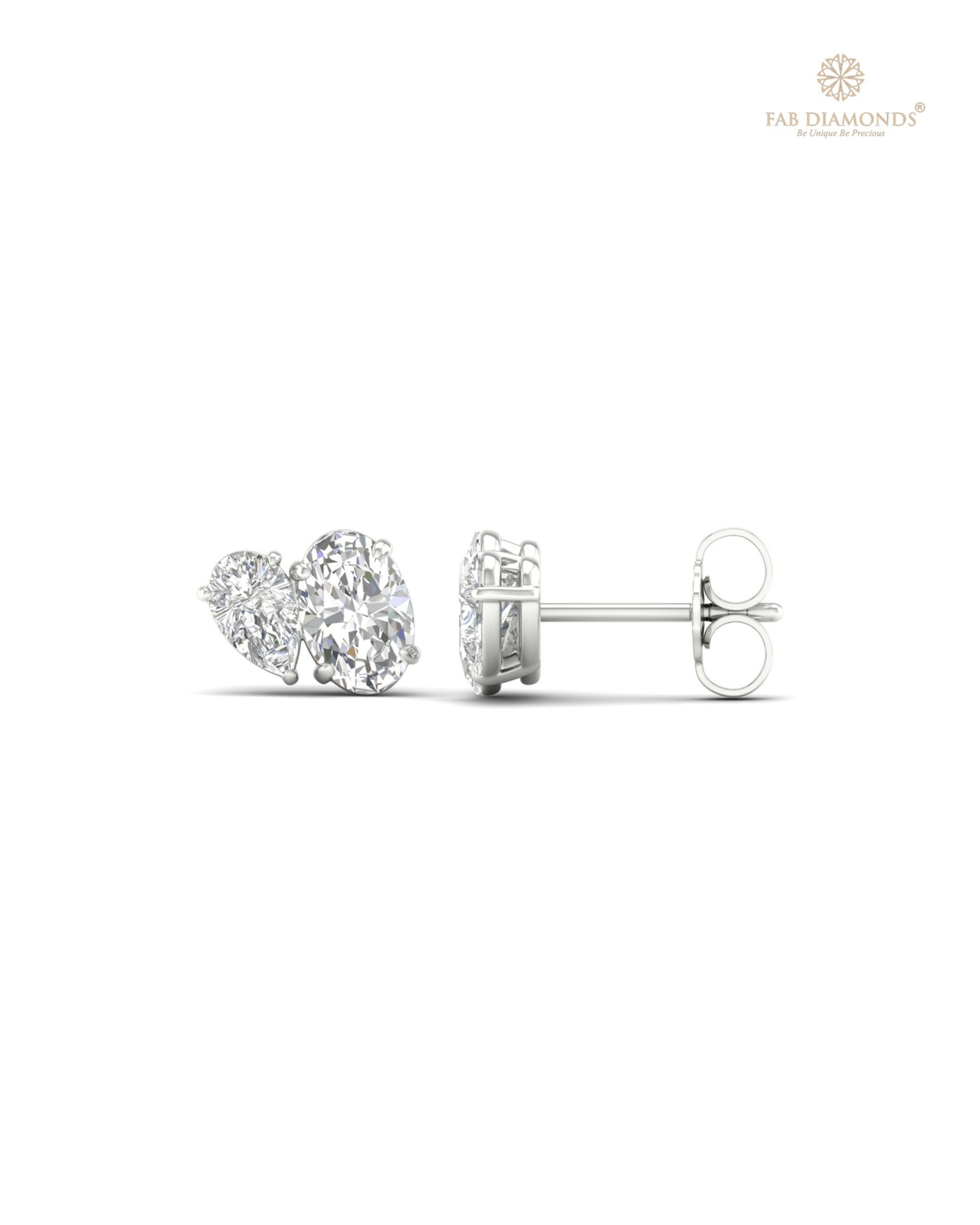 The ES10474 Diamond Halo Diamond Studs (1.40 Cts) on white atelier plate with FAB hallmark