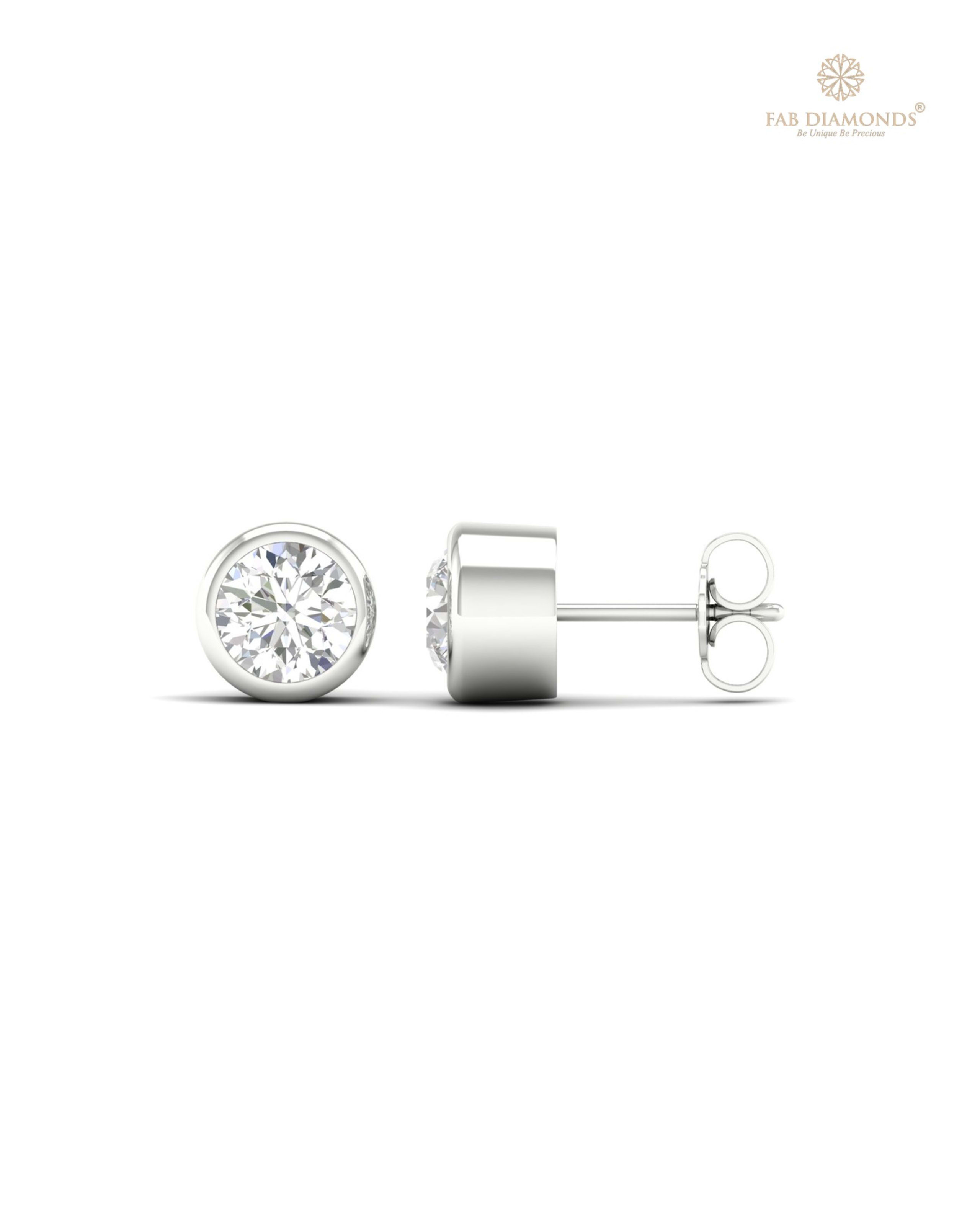 The ES10527 Classic Solitaire Diamond Studs (2.00 Cts) on white atelier plate with FAB hallmark