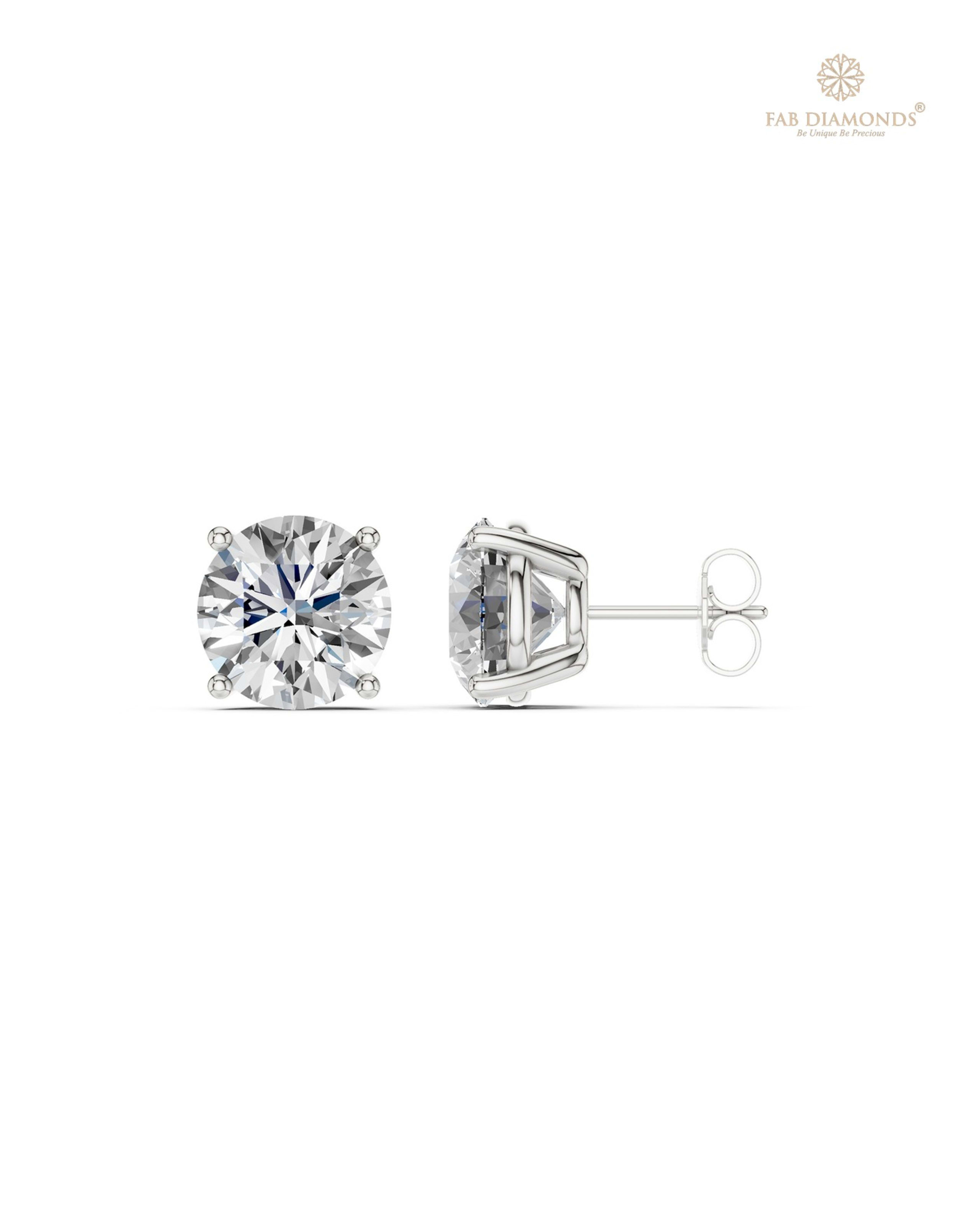 The ES10693 Classic Solitaire Diamond Studs (8.00 Cts) on white atelier plate with FAB hallmark