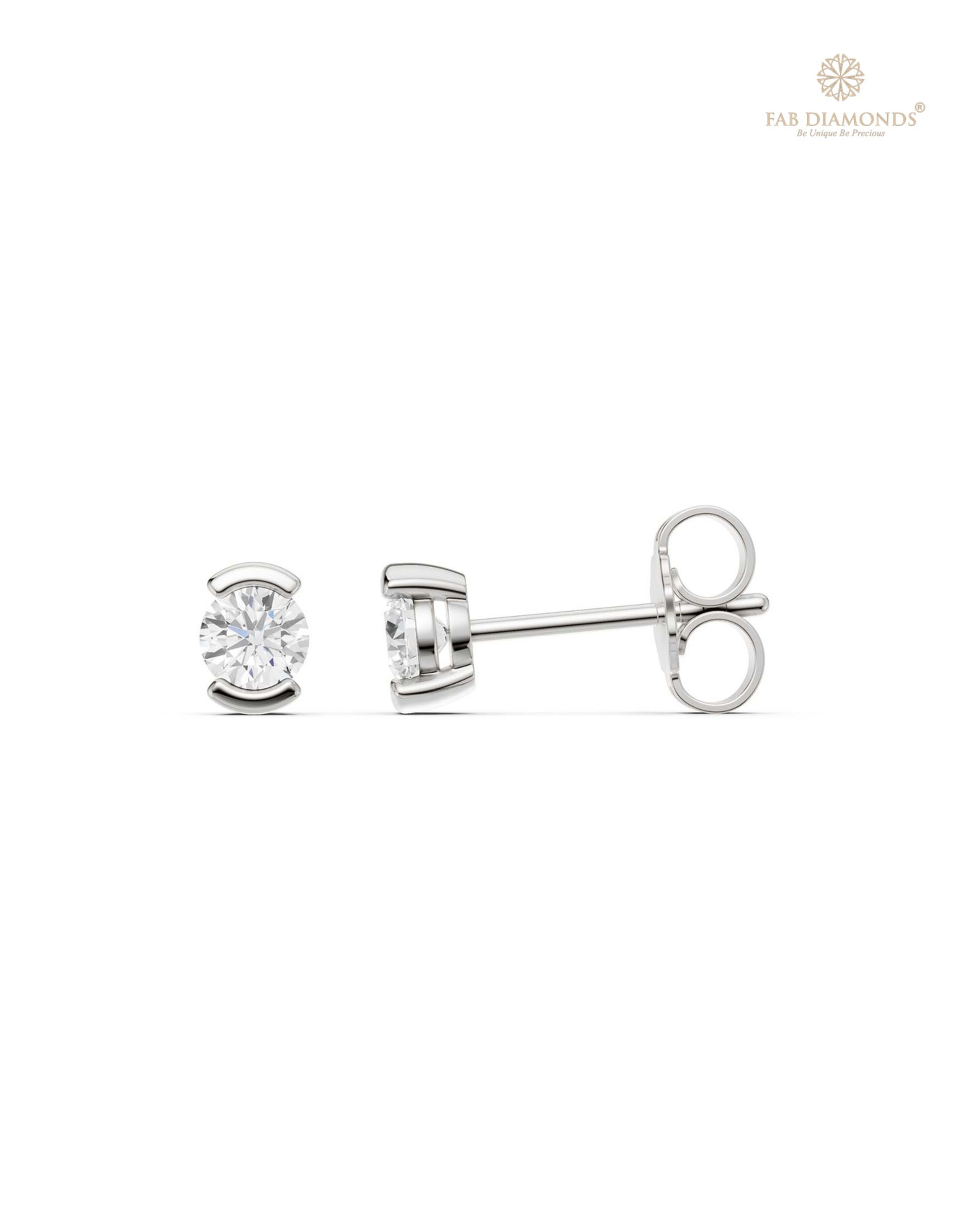 The ES10922 Classic Solitaire Diamond Studs (0.30 Cts) on white atelier plate with FAB hallmark