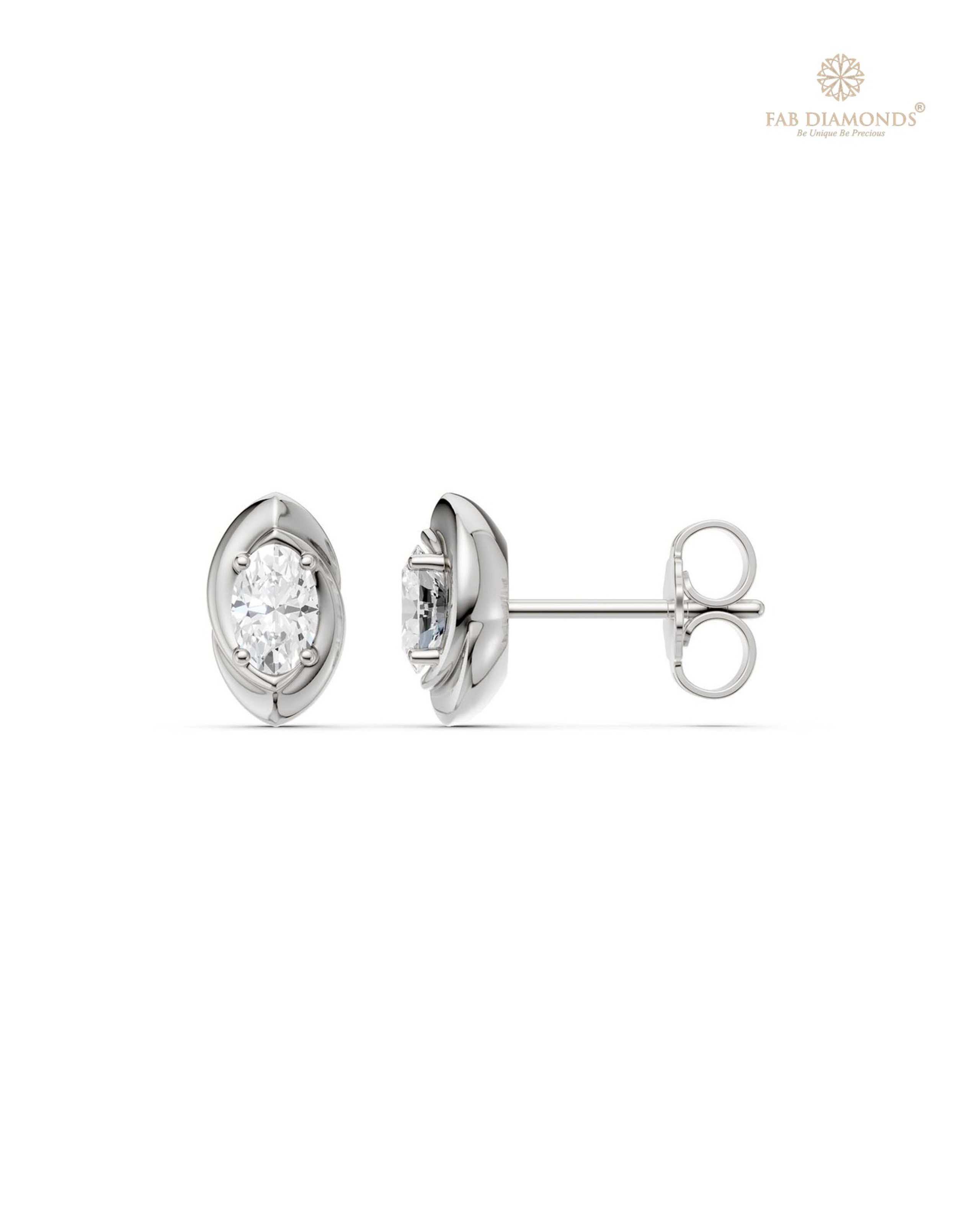The ES10925 Classic Solitaire Diamond Studs (0.54 Cts) on white atelier plate with FAB hallmark