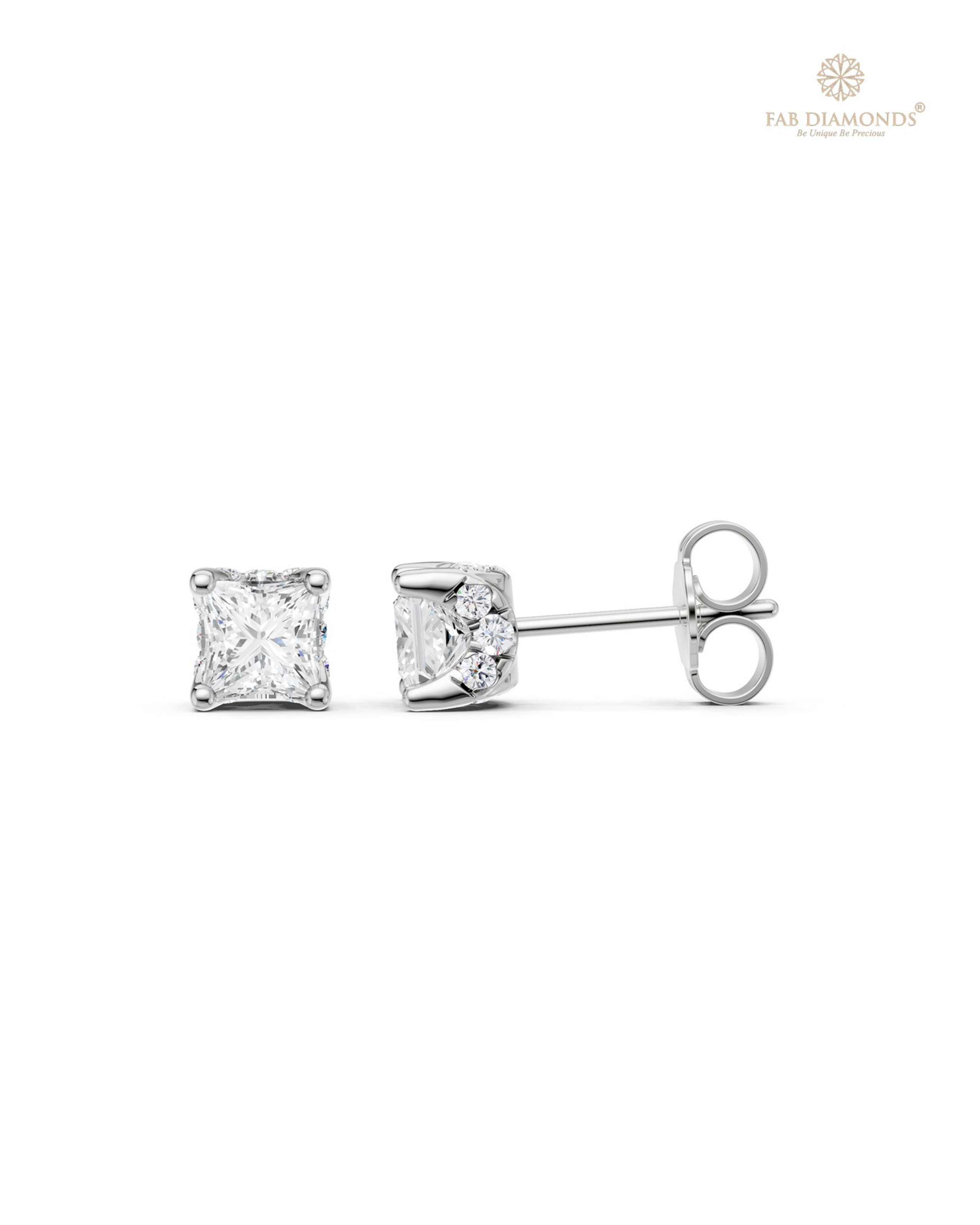 The ES10956 Diamond Halo Diamond Studs (0.99 Cts) on white atelier plate with FAB hallmark