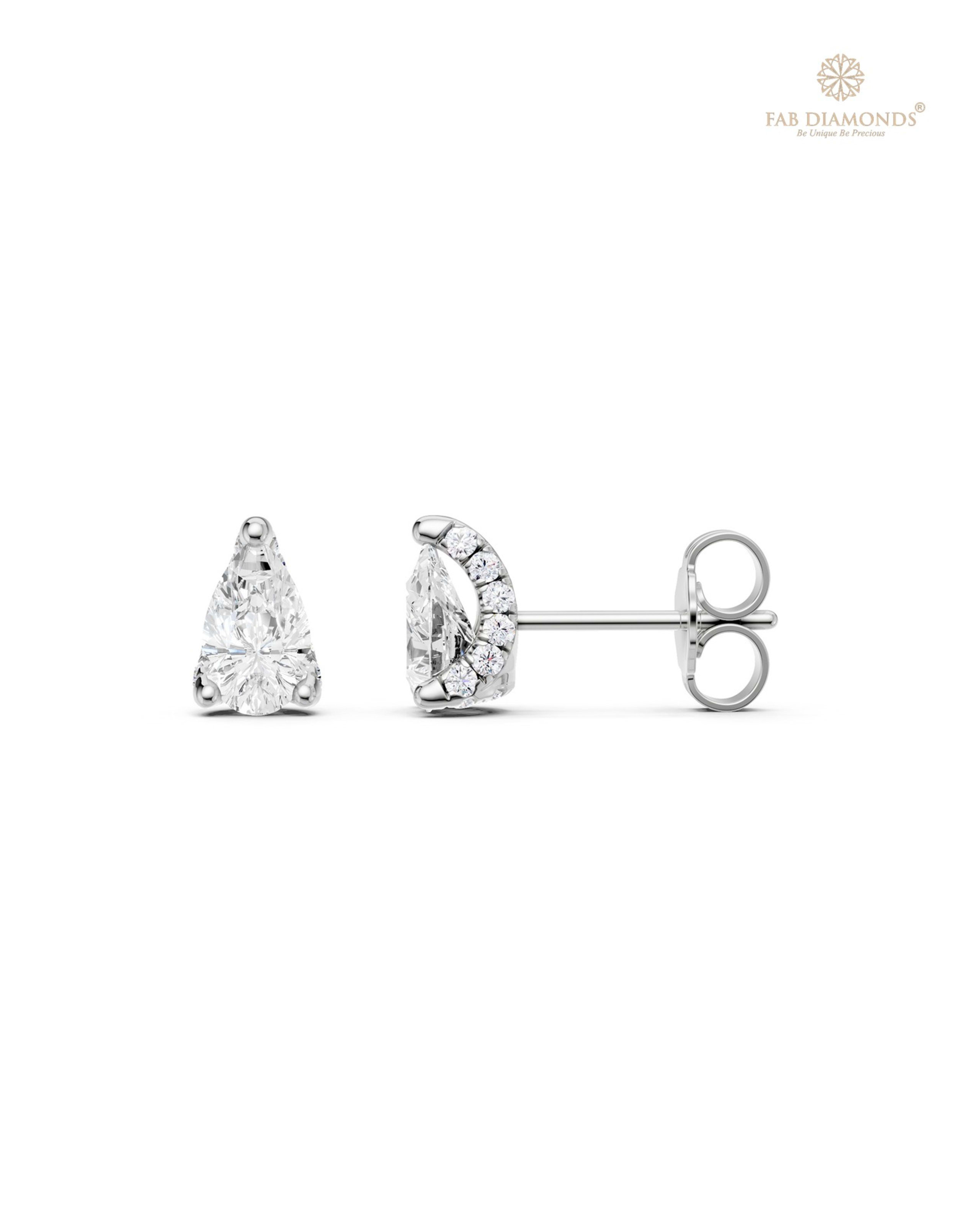 The ES10957 Diamond Halo Diamond Studs (0.99 Cts) on white atelier plate with FAB hallmark