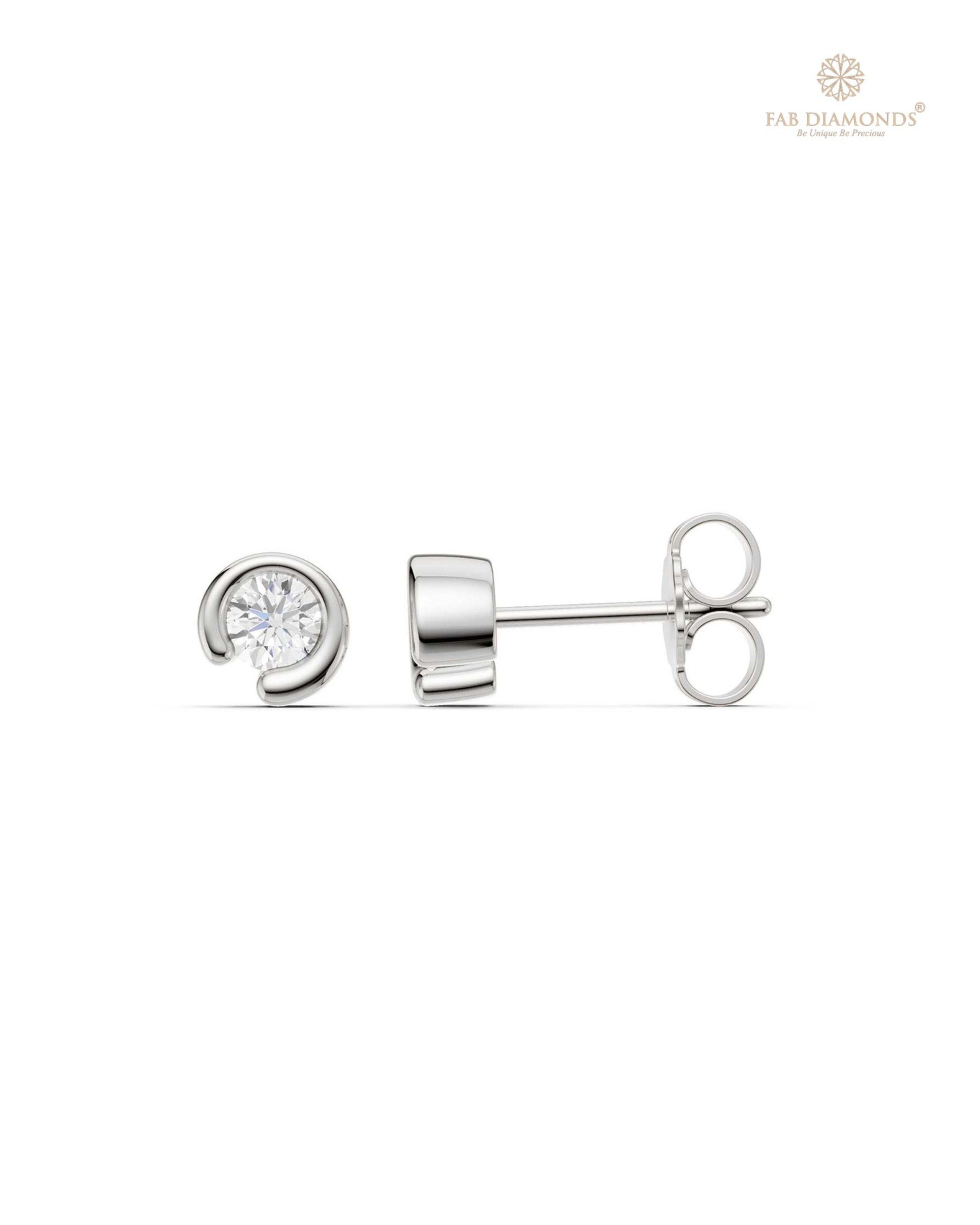 The ES10959 Classic Solitaire Diamond Studs (0.40 Cts) on white atelier plate with FAB hallmark