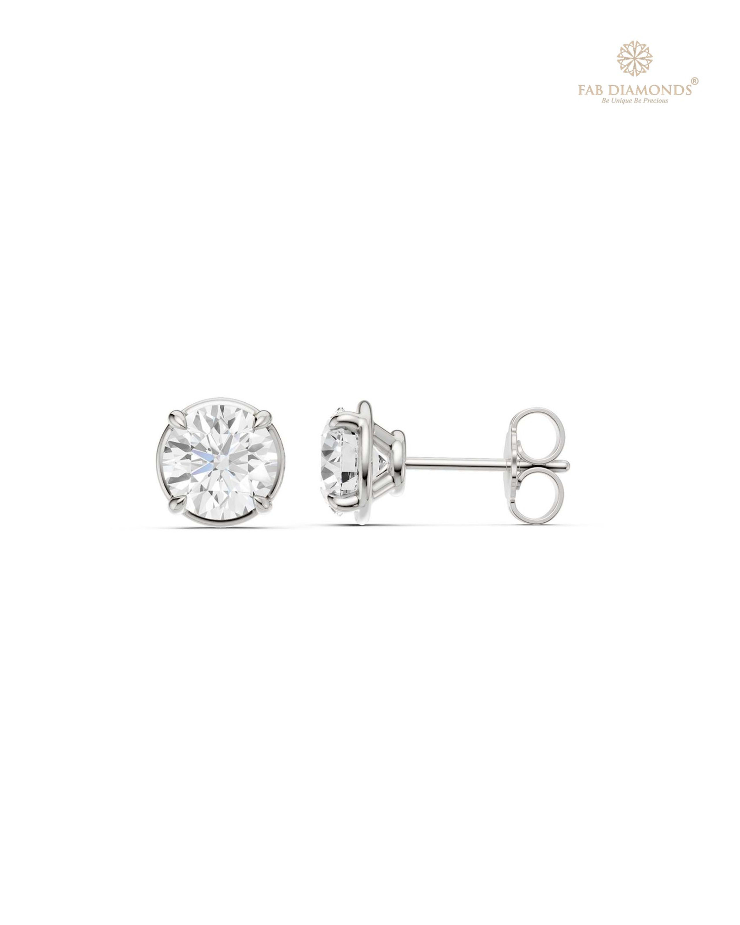 The ES10960 Classic Solitaire Diamond Studs (2.00 Cts) on white atelier plate with FAB hallmark