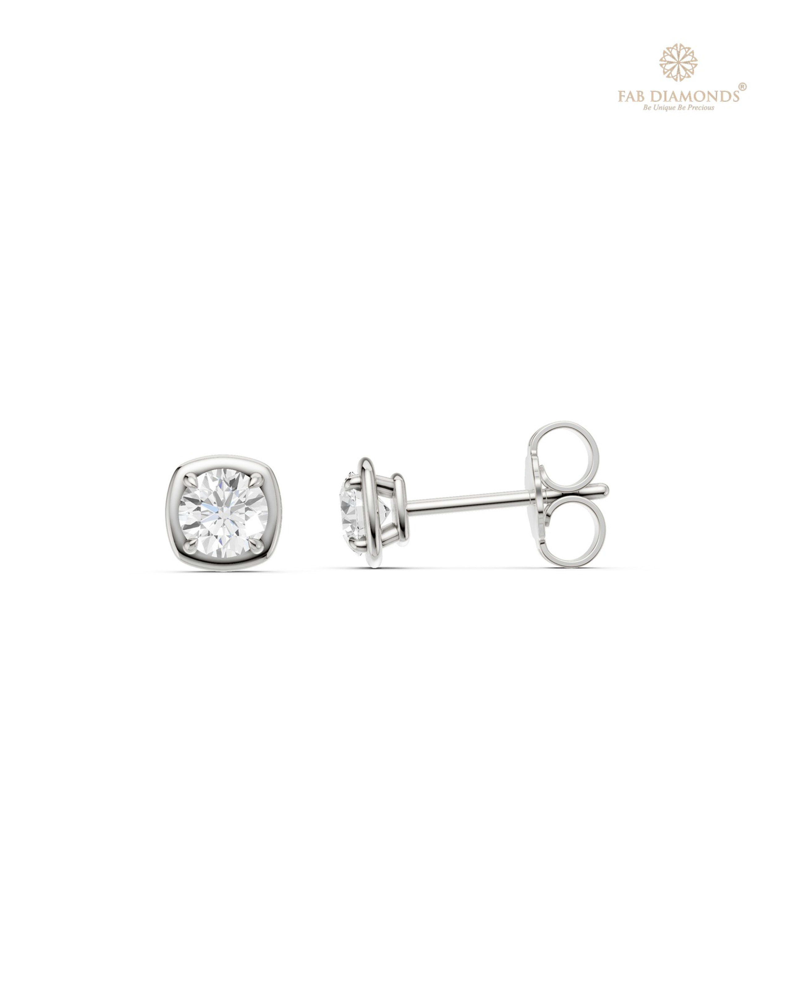 The ES10987 Classic Solitaire Diamond Studs (0.50 Cts) on white atelier plate with FAB hallmark