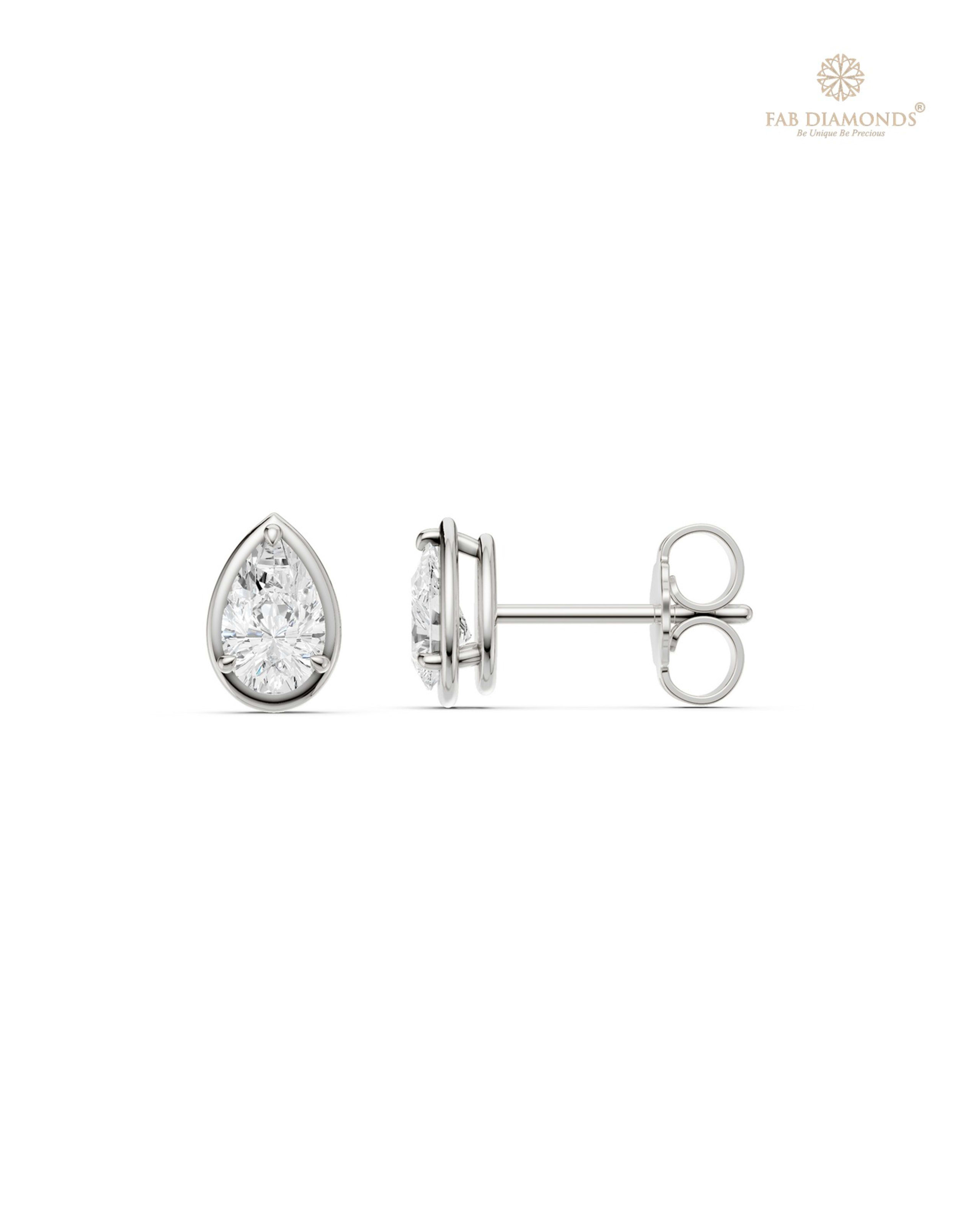 The ES10990 Classic Solitaire Diamond Studs (0.54 Cts) on white atelier plate with FAB hallmark