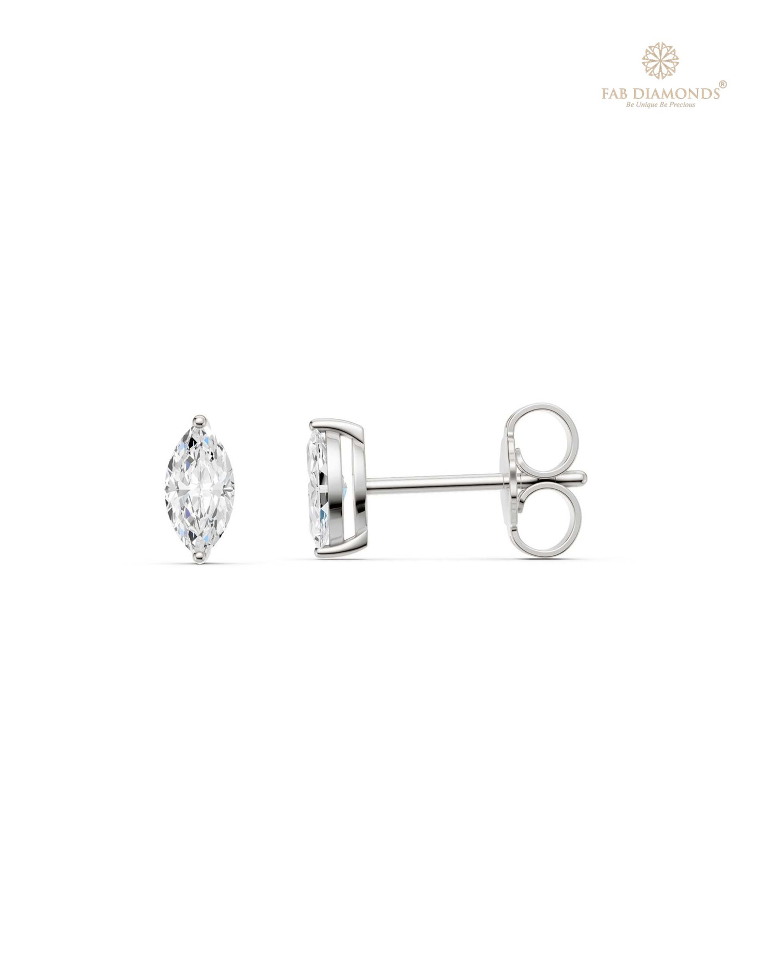 The ES10995 Classic Solitaire Diamond Studs (0.30 Cts) on white atelier plate with FAB hallmark