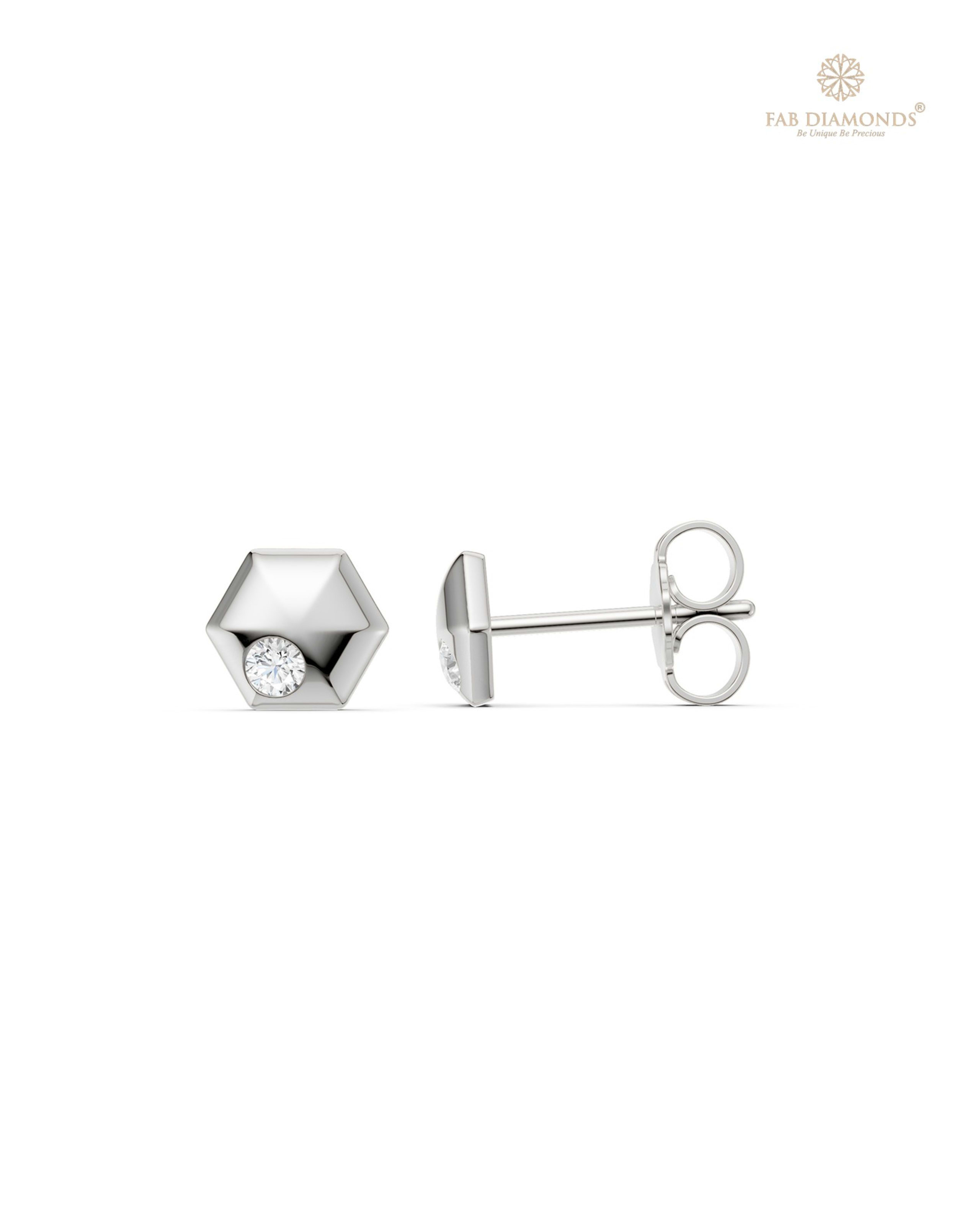 The ES11002 Classic Solitaire Diamond Studs (0.09 Cts) on white atelier plate with FAB hallmark