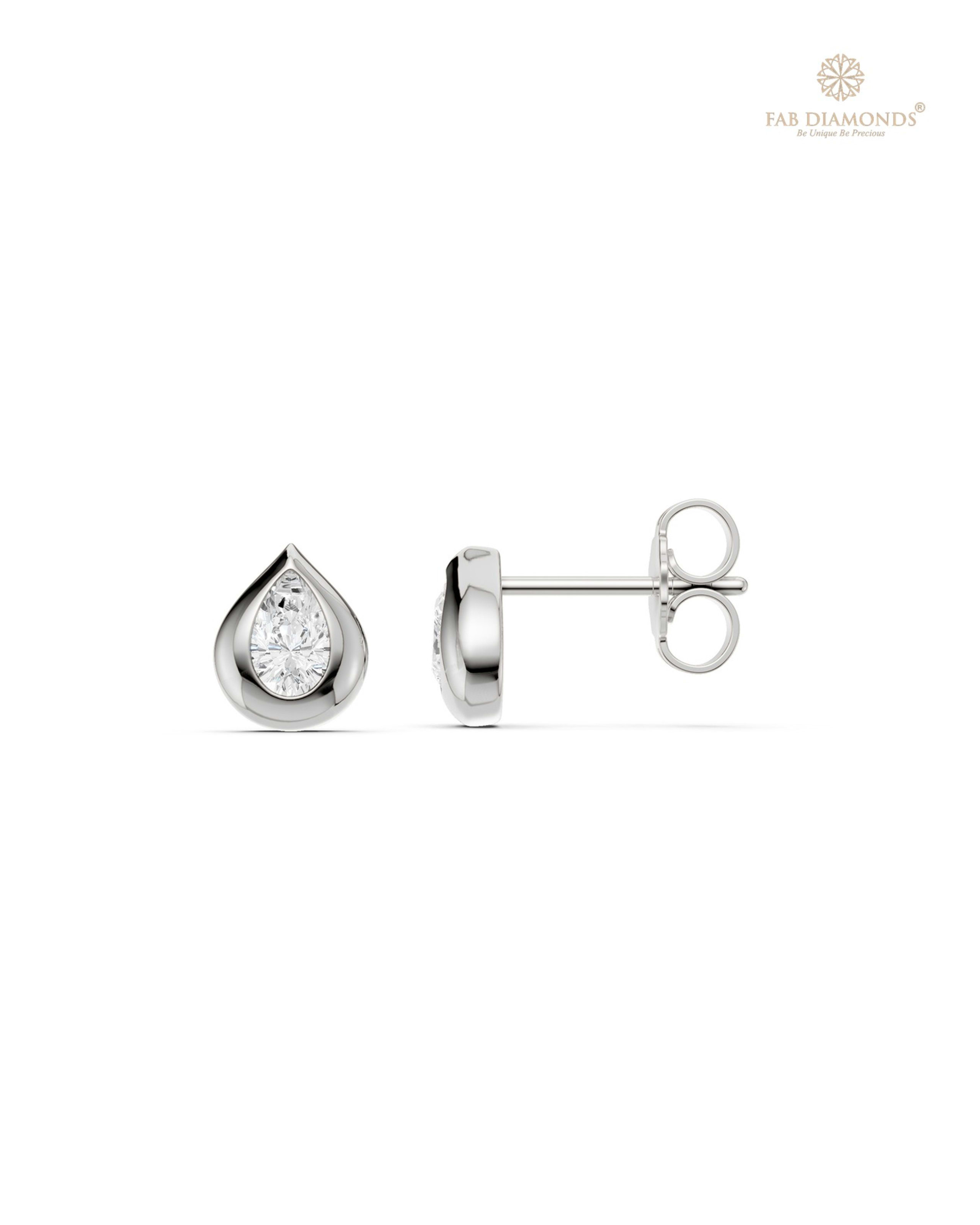 The ES11004 Classic Solitaire Diamond Studs (0.32 Cts) on white atelier plate with FAB hallmark