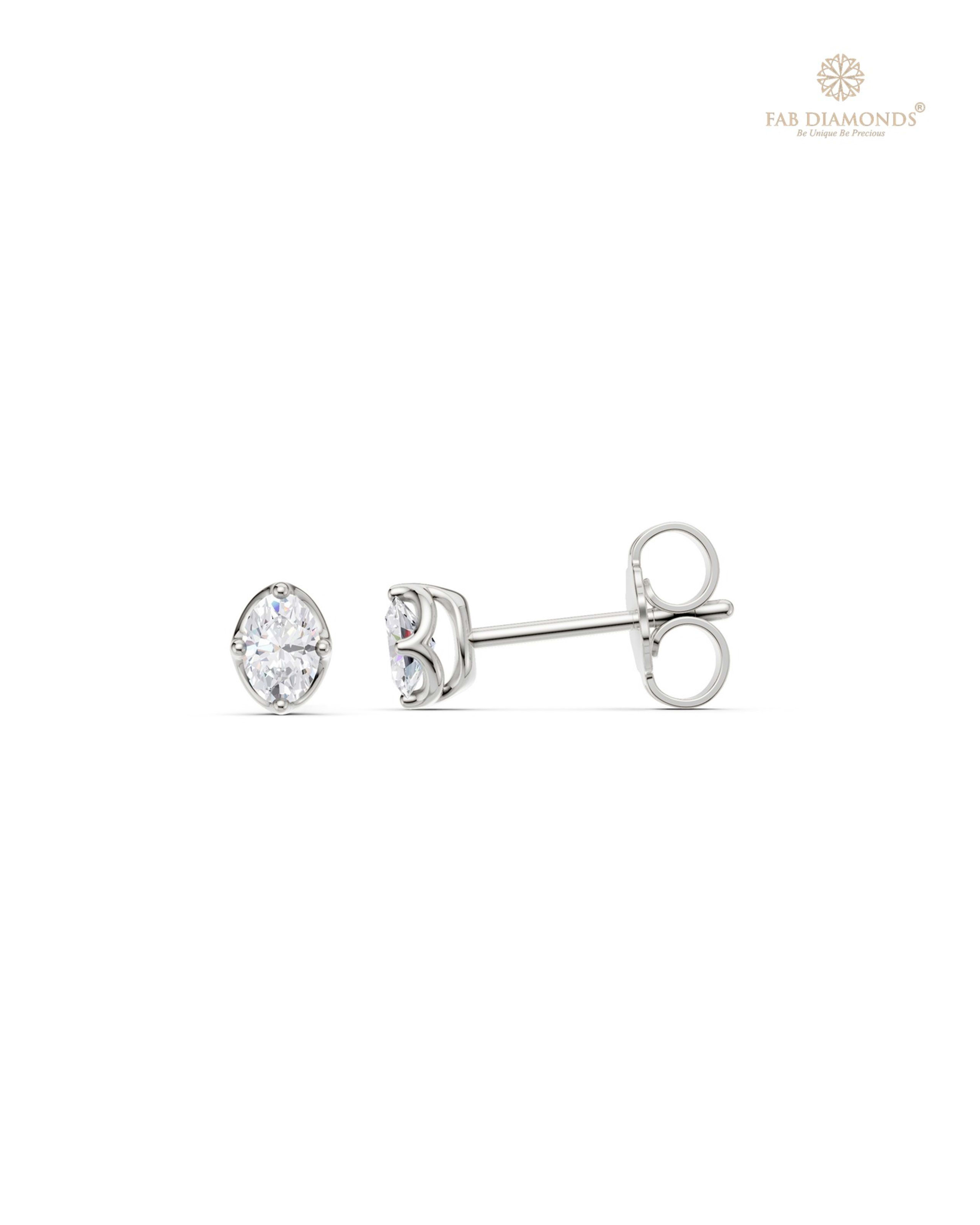 The ES11140 Classic Solitaire Diamond Studs (0.24 Cts) on white atelier plate with FAB hallmark