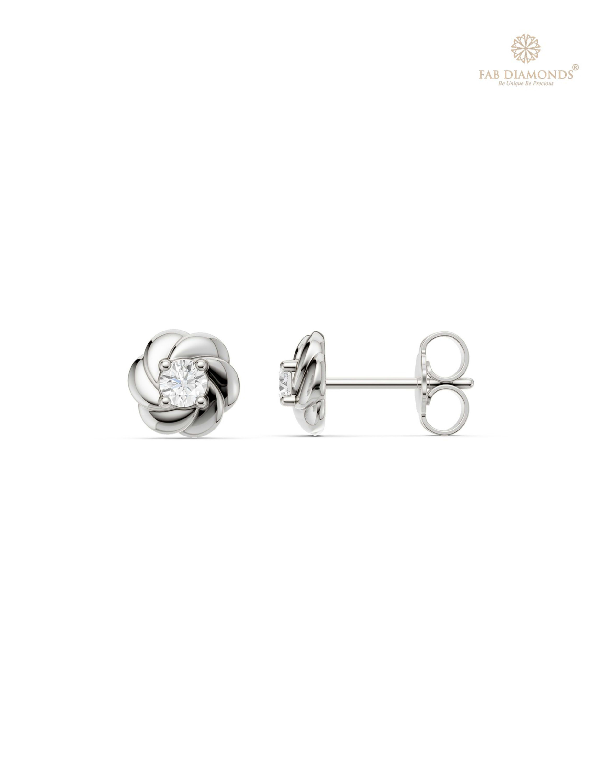 The ES11151 Classic Solitaire Diamond Studs (0.20 Cts) on white atelier plate with FAB hallmark