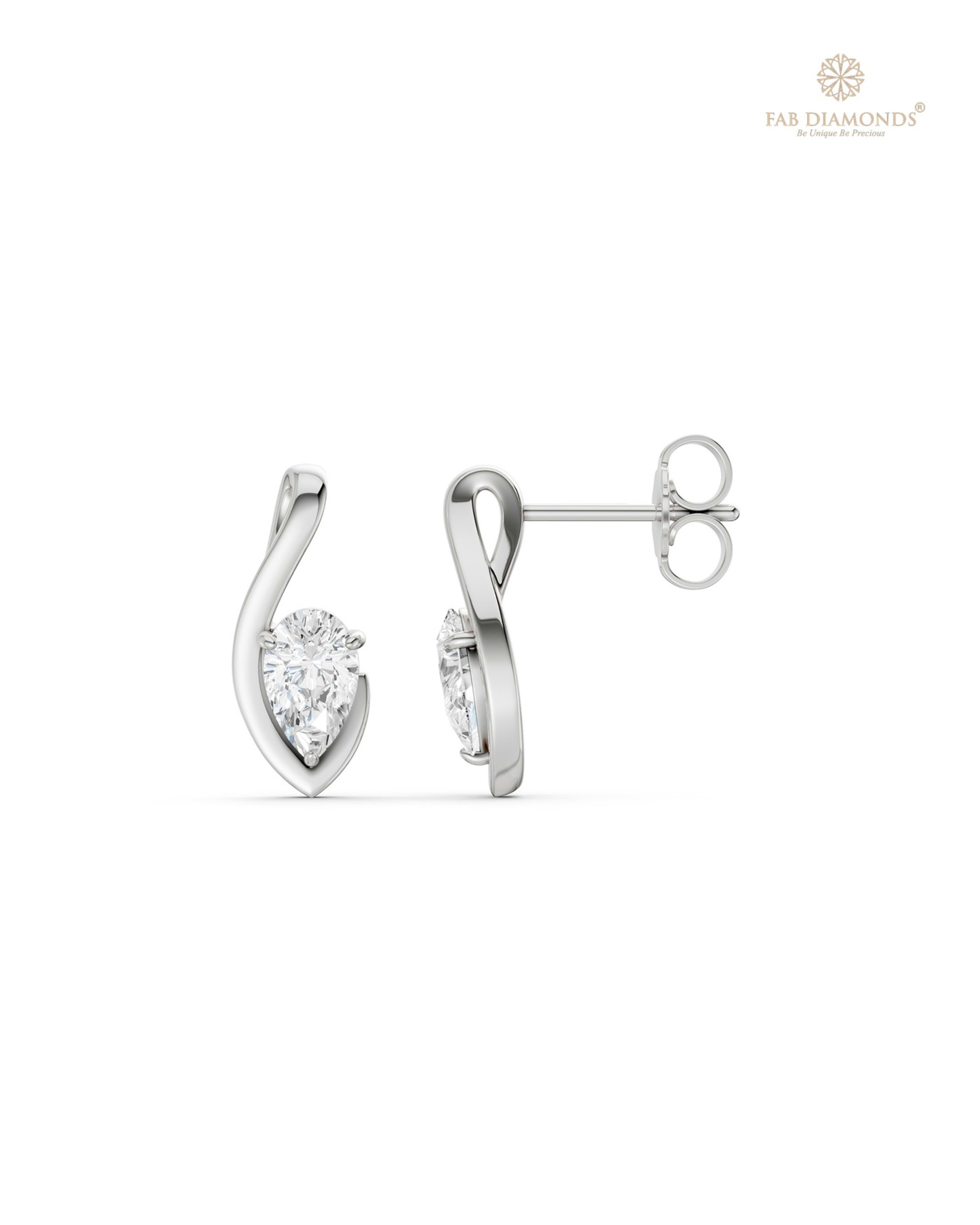 The ES11260 Classic Solitaire Diamond Studs (1.04 Cts) on white atelier plate with FAB hallmark