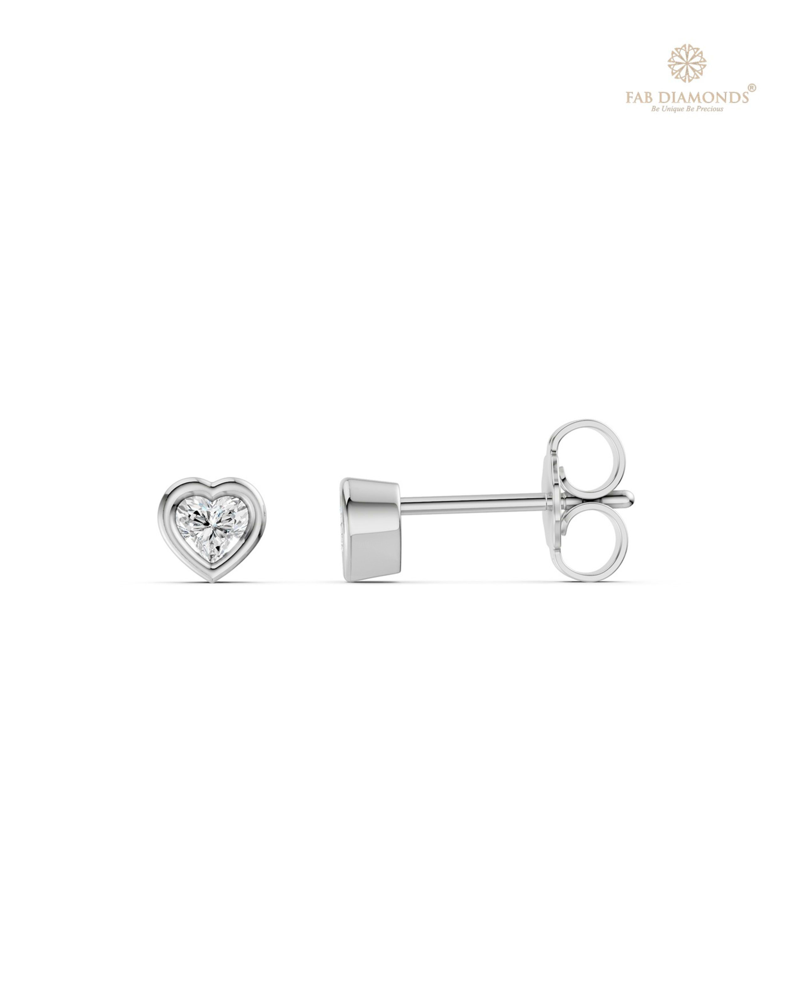 The ES11504 Classic Solitaire Diamond Studs (0.20 Cts) on white atelier plate with FAB hallmark