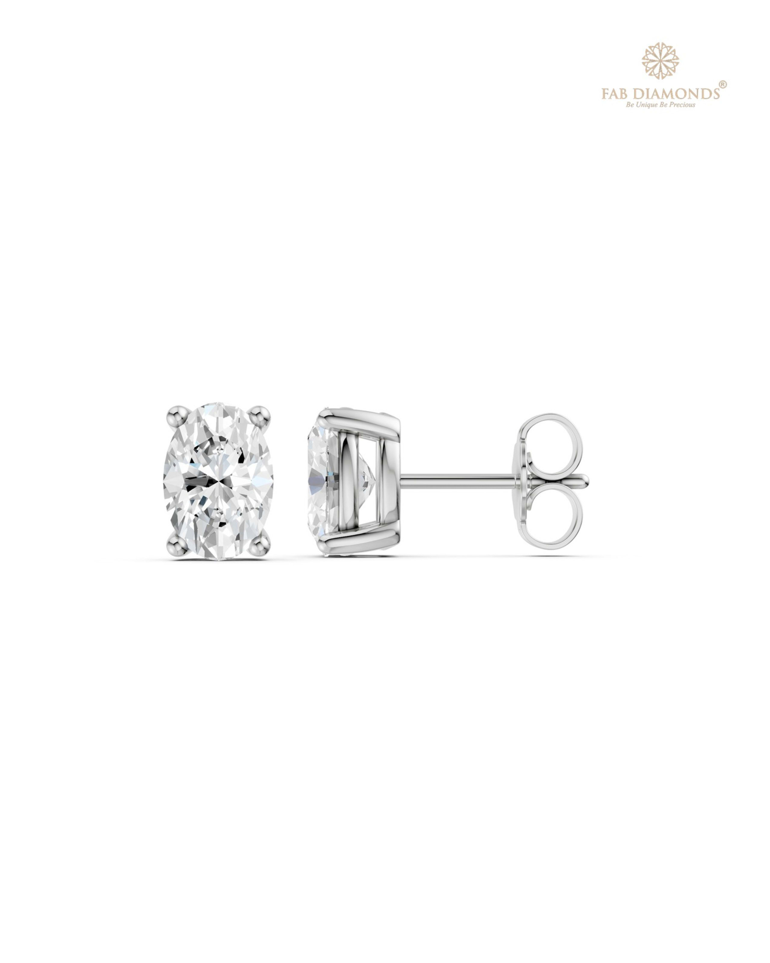 The ES11526 Classic Solitaire Diamond Studs (1.50 Cts) on white atelier plate with FAB hallmark
