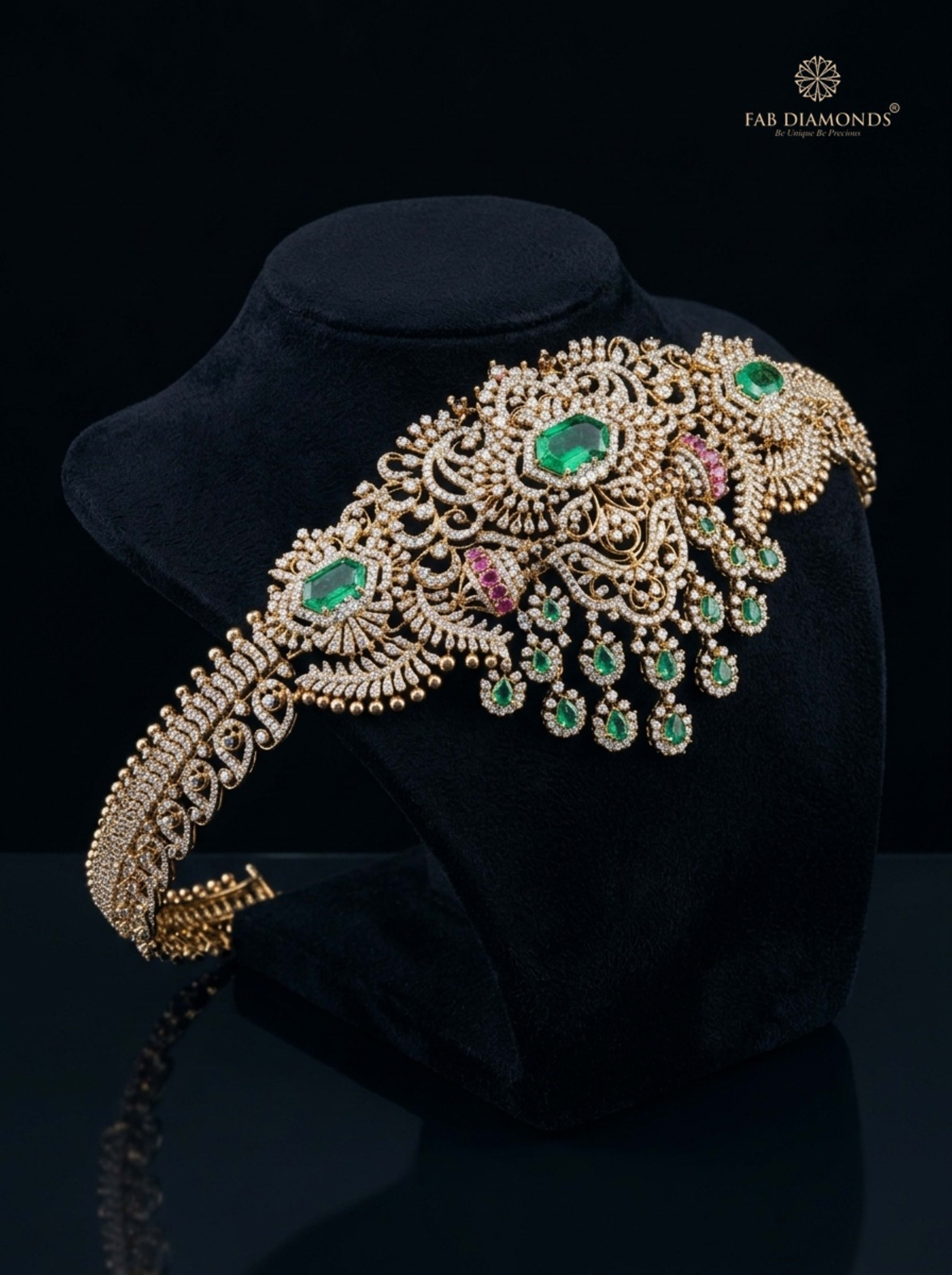 Annapurna foliate emerald and diamond vaddanam on dark stone plinth