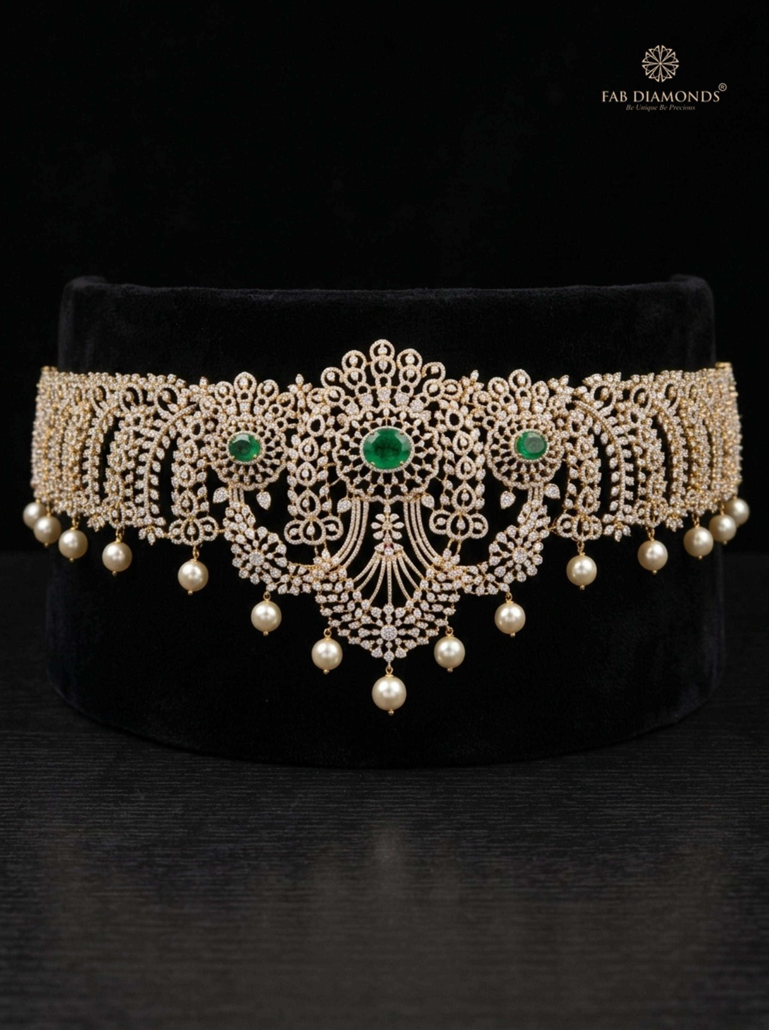 Padmavati South Sea pearl fringe diamond vaddanam on royal plum velvet display stand