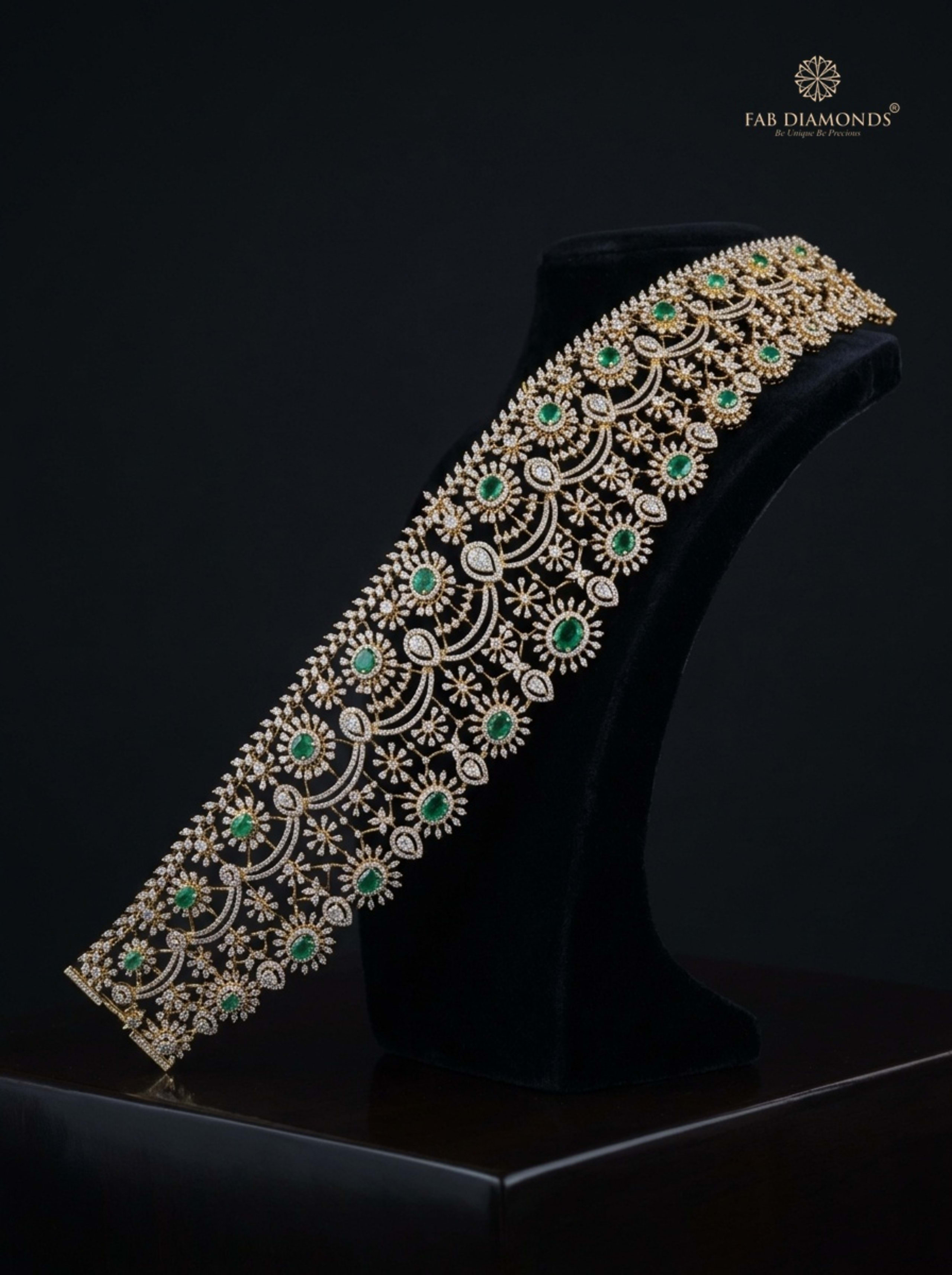 Yamuna repeating emerald plaque diamond vaddanam on modern dark studio plinth