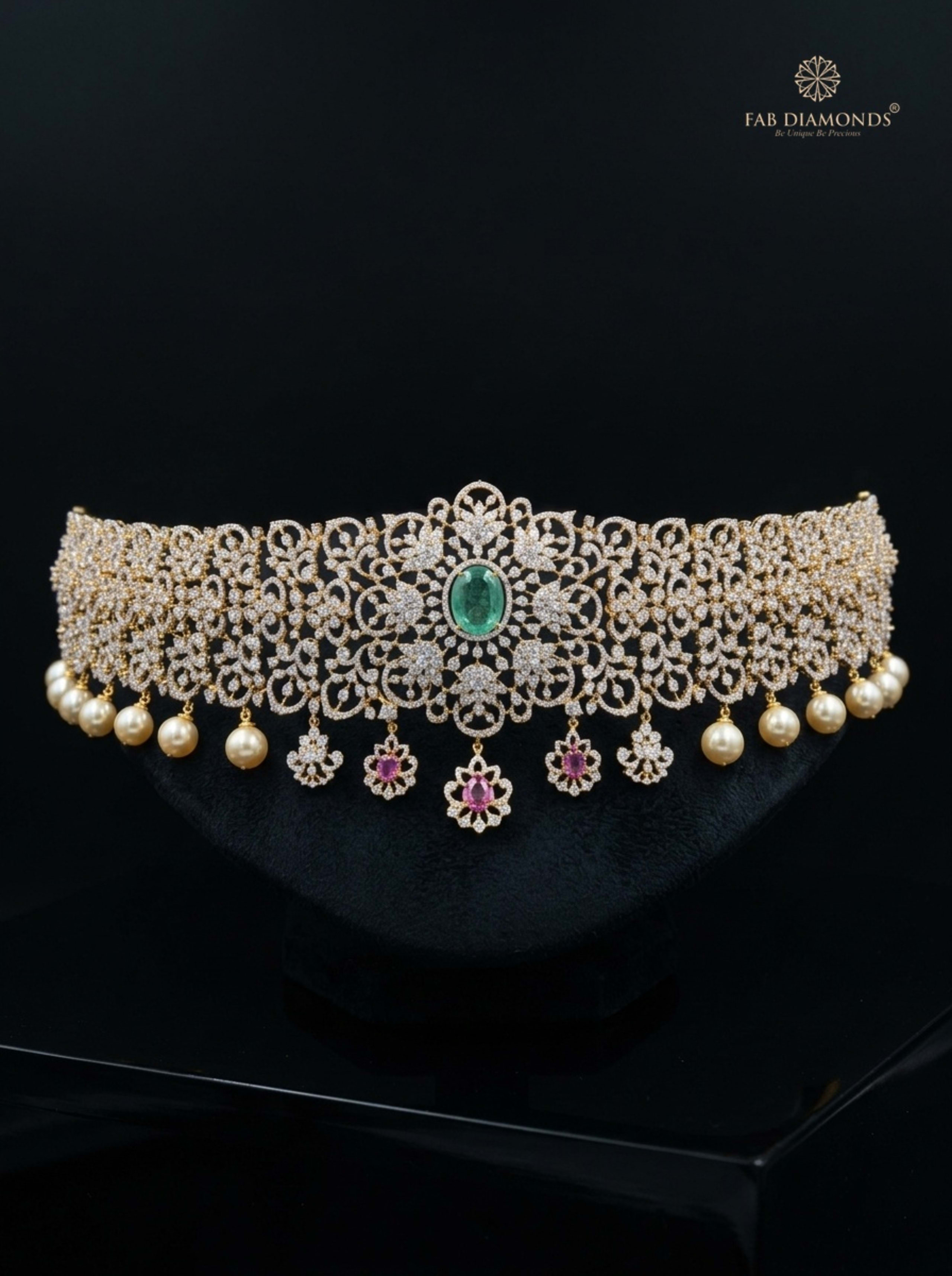 Bhavani pink sapphire, emerald, and pearl fringe vaddanam on plum velvet display