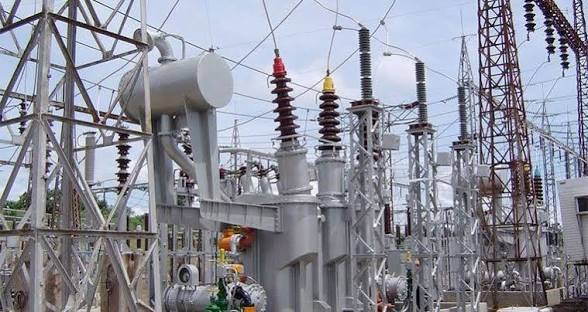 An electricity substation equipped with transformers and high-voltage transmission infrastructure. 