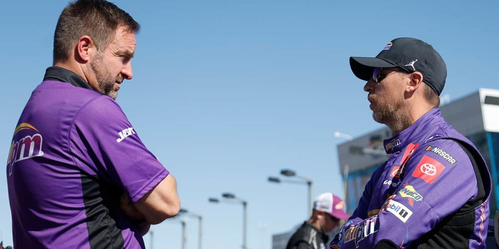Denny Hamlin, right, speaks with No. 11 crew chief Chris Gayle on the pit road at Las Vegas Motor Speedway