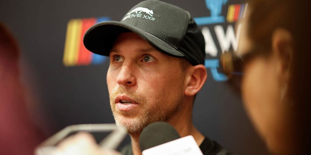 Denny Hamlin speaks to media before the NASCAR Awards banquet in Scottsdale, Ariz.
