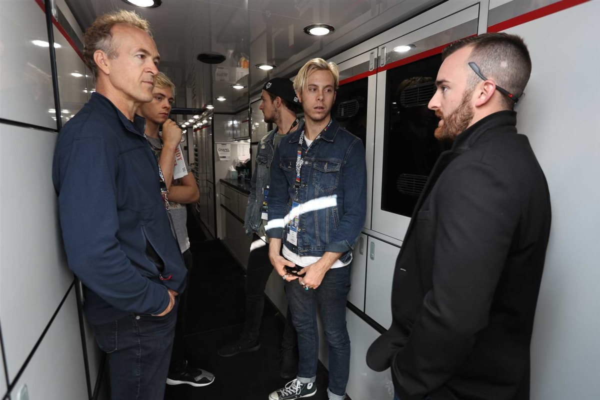 Austin Dillon give a hauler tour to members of the band R5.