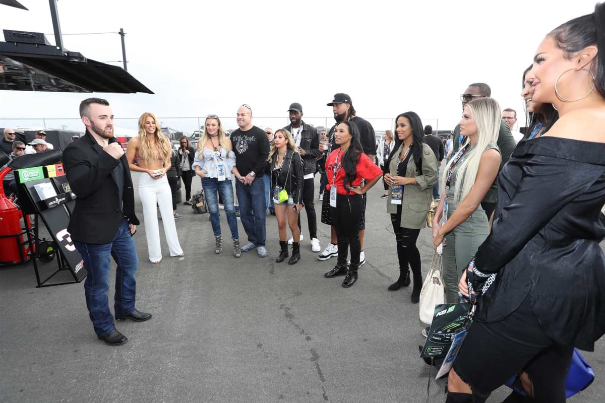 Austin Dillon talks with the cast of the reality show WAGS.