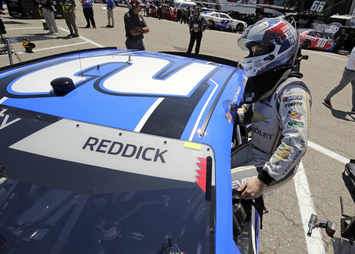 Tyler Reddick hopping in his No. 2 KC Motorgroup Chevrolet Camaro moments before his practice laps at Michigan International Speedway.