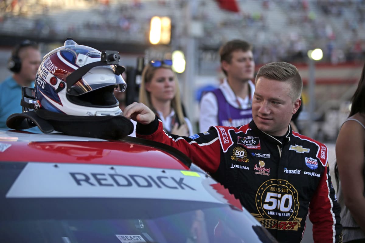Tyler Reddick prepares to climb in his No. 2 Tame the Beast Chevrolet for Friday night's race at Bristol Motor Speedway.