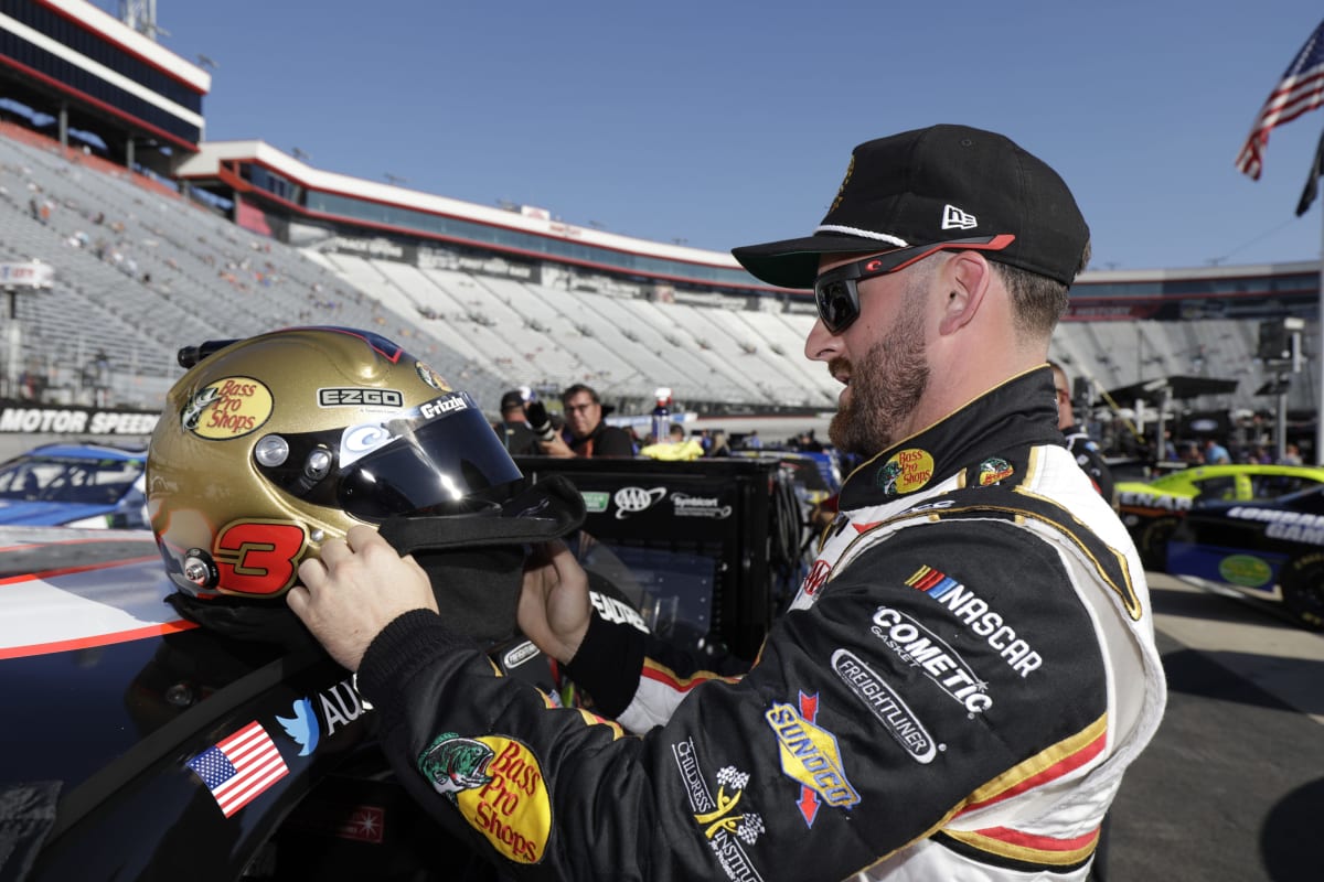 Austin Dillon prepares his helmet prior to strapping in the No. 3 Bass Pro Shops/Tracker Off Road Chevrolet for qualifying at Bristol Motor Speedway.