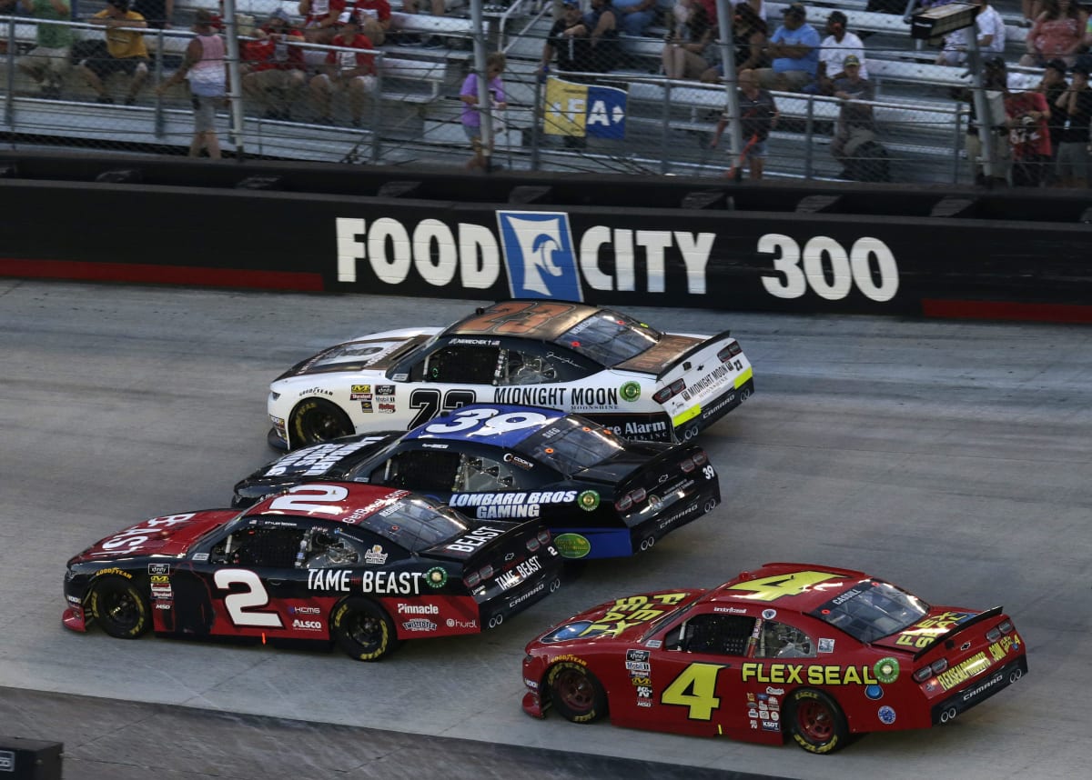 Tyler Reddick makes an aggressive move on the bottom of a three-wide situation early in the race. Reddick had to start in the rear and make a pass-through penalty at the start of the race.