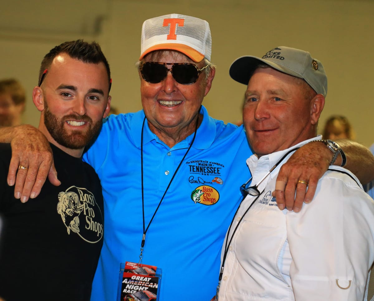 Austin Dillon, fisherman Bill Dance and Bass Pro Shops founder Johnny Morris pose for a quick photo prior to Saturday night's driver/crew chief meeting.