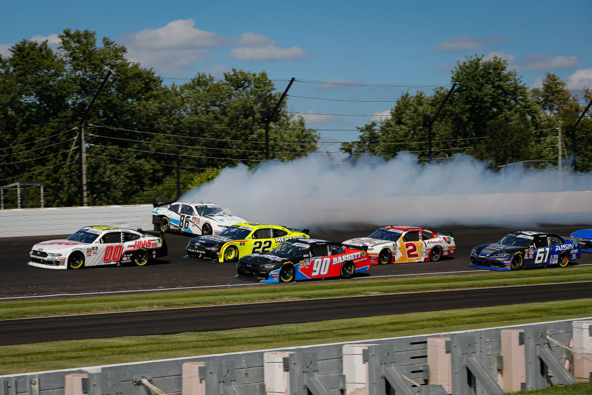 Tyler Reddick drives low to avoid the spinning No. 86 during Saturday's NASCAR Xfinity Series race at Indianapolis Motor Speedway. (HHP/Barry Cantrell)