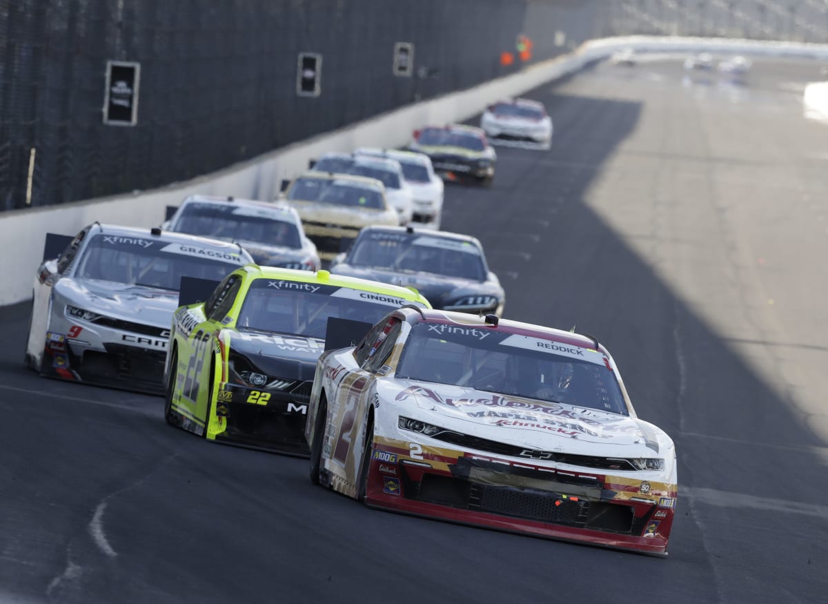 Tyler Reddick's No. 2 Anderson's Maple Syrup Chevrolet leads a pack of cars into Turn 1 during Saturday's NASCAR Xfinity Series race at Indianapolis Motor Speedway.  (HHP/Garry Eller)