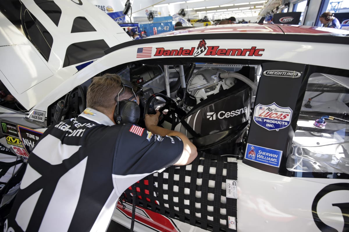 Daniel Hemric debriefs with a team member in between practice runs on Friday.