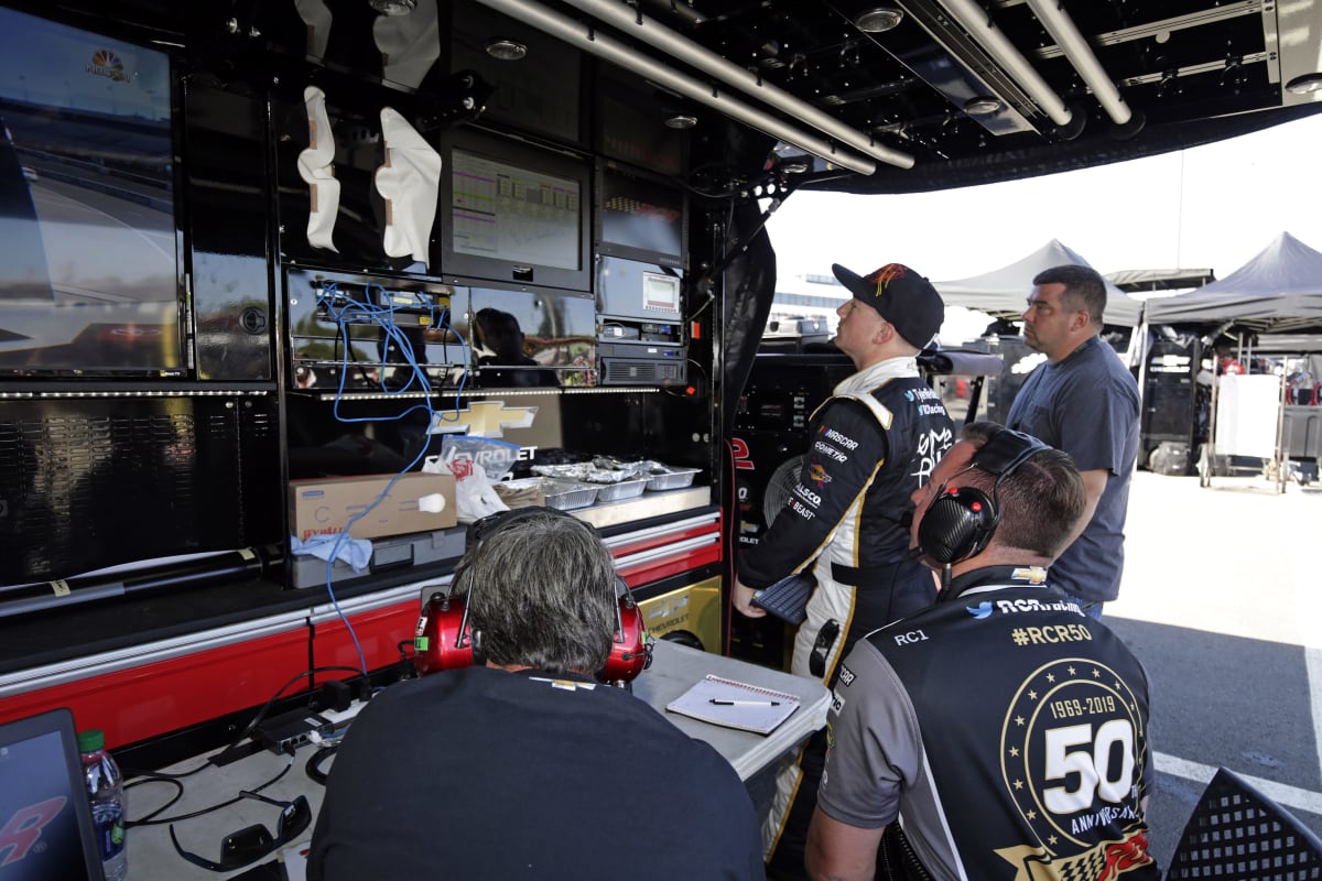 Tyler Reddick looks over the scoring data between practice runs Friday at Richmond Raceway.