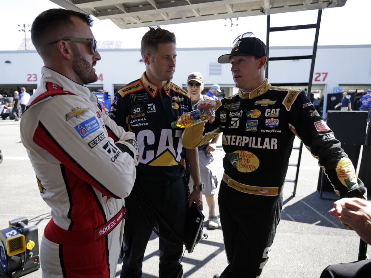 Daniel Hemric and crew chief Luke Lambert check in with teammate Austin Dillon between Cup Series practice sessions at Richmond Raceway.