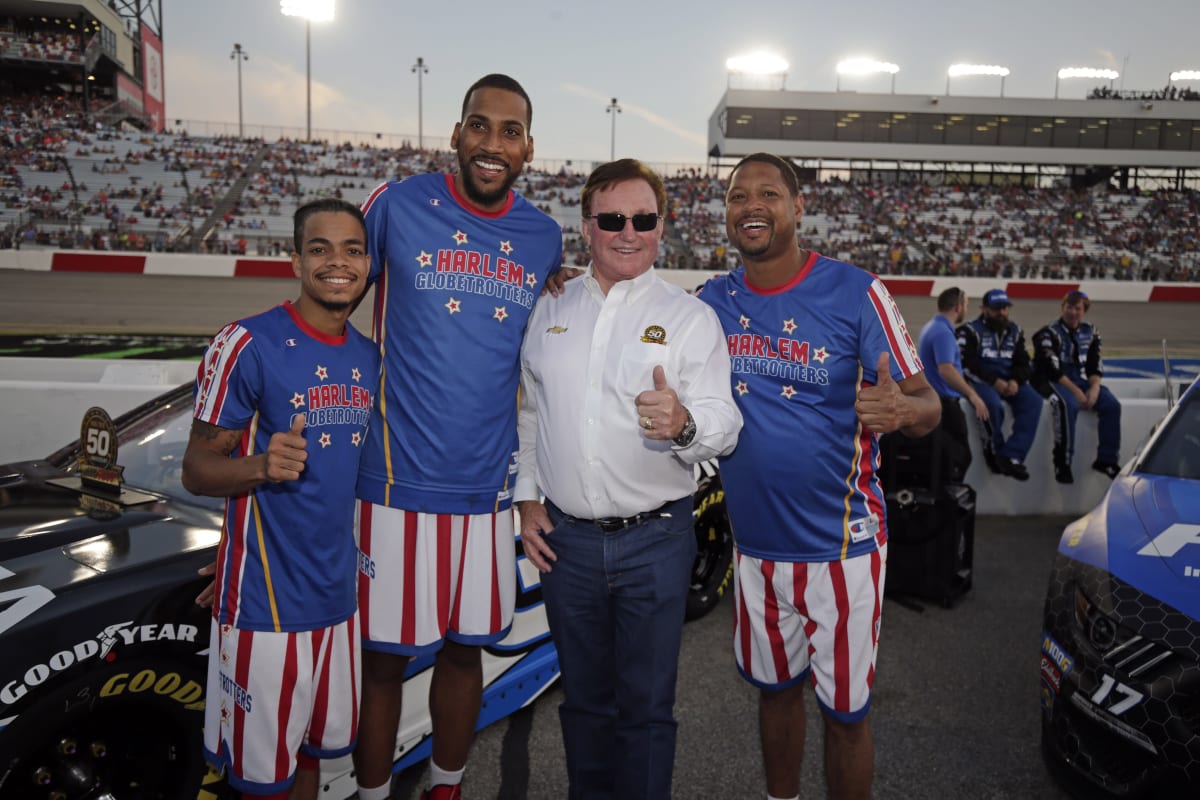 Team owner Richard Childress meets members of the Harlem Globetrotters before Saturday night's Cup race at Richmond Raceway.