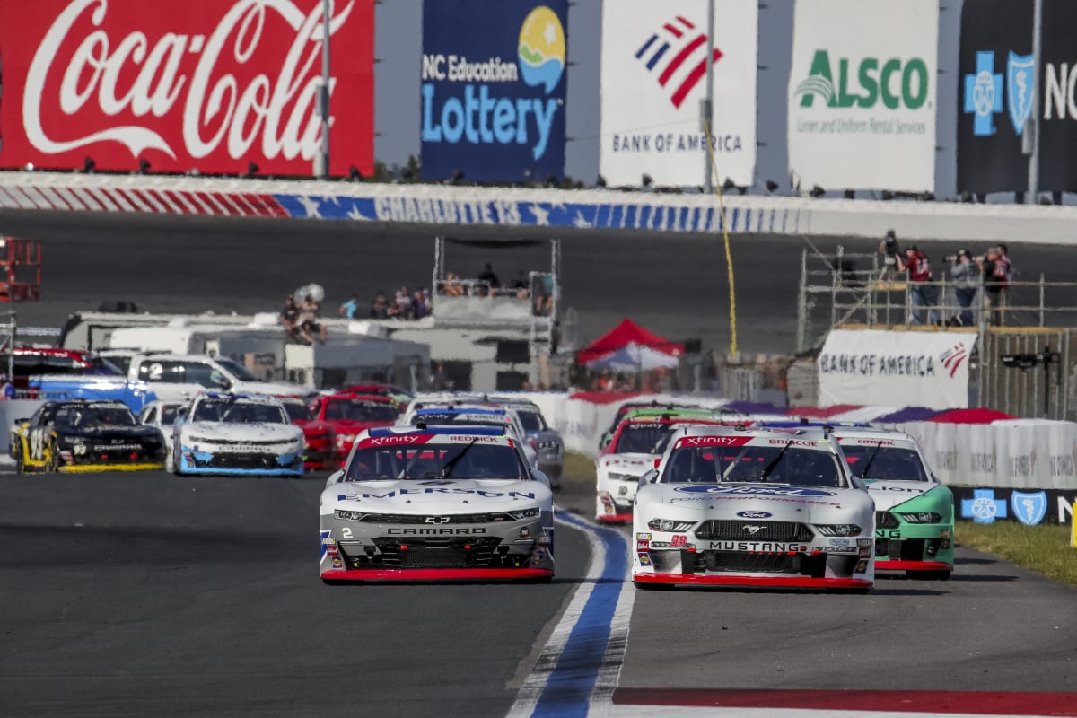 Tyler Reddick battles with Chase Briscoe for the race lead during the opening lap of Saturday's race at the Roval.